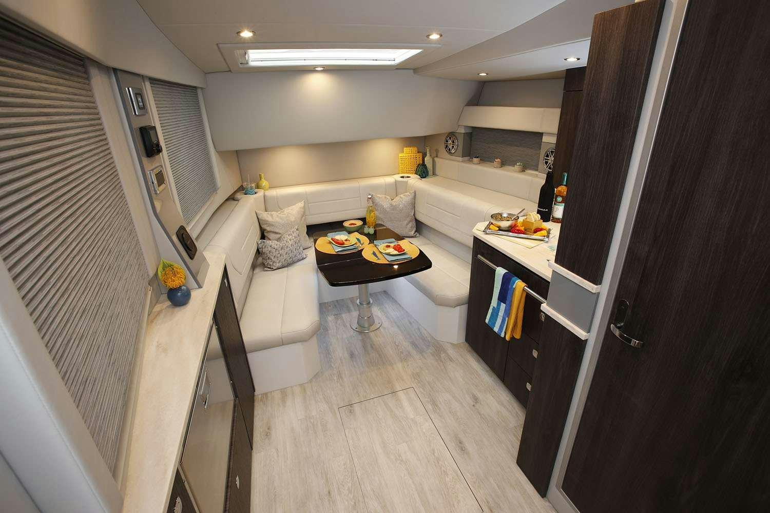 a small kitchen with a dining table aboard Life Is Good Yacht for Charter