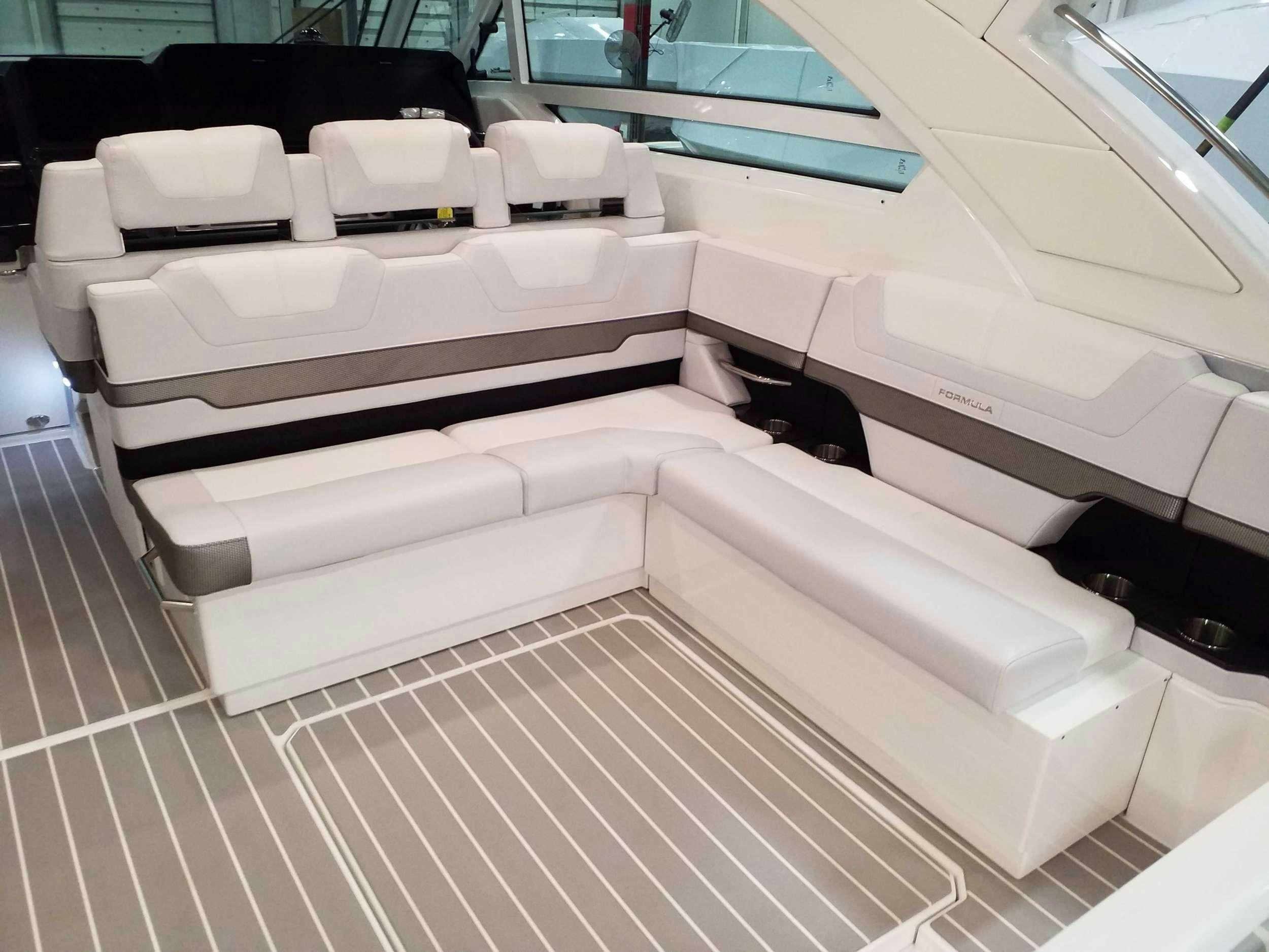 a room with a row of seats aboard Life Is Good Yacht for Charter