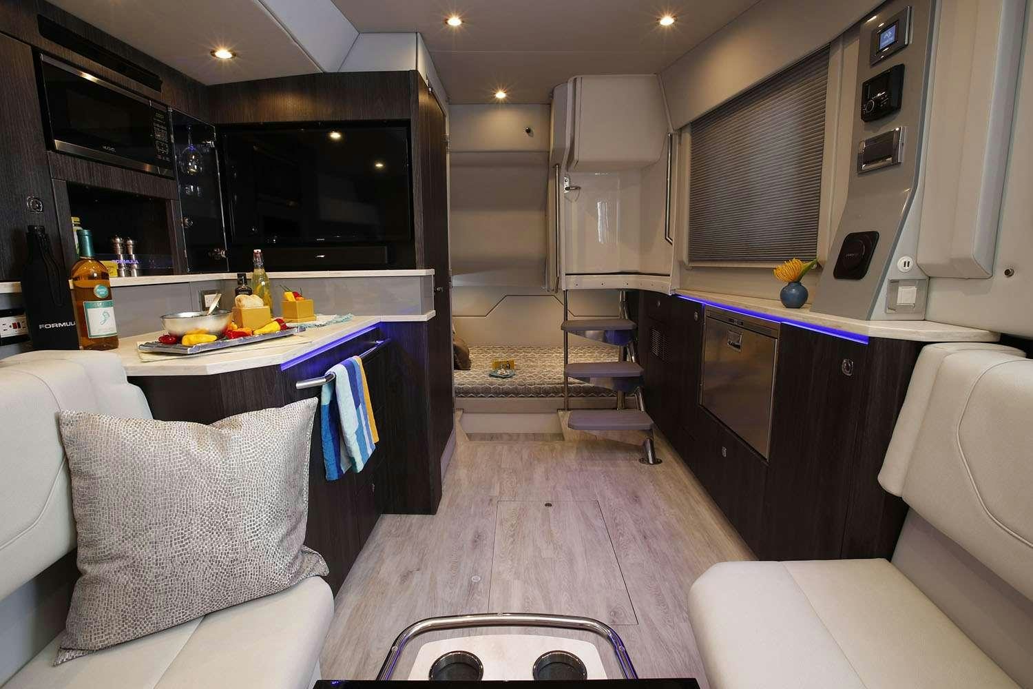 a kitchen with a bar and a table aboard Life Is Good Yacht for Charter