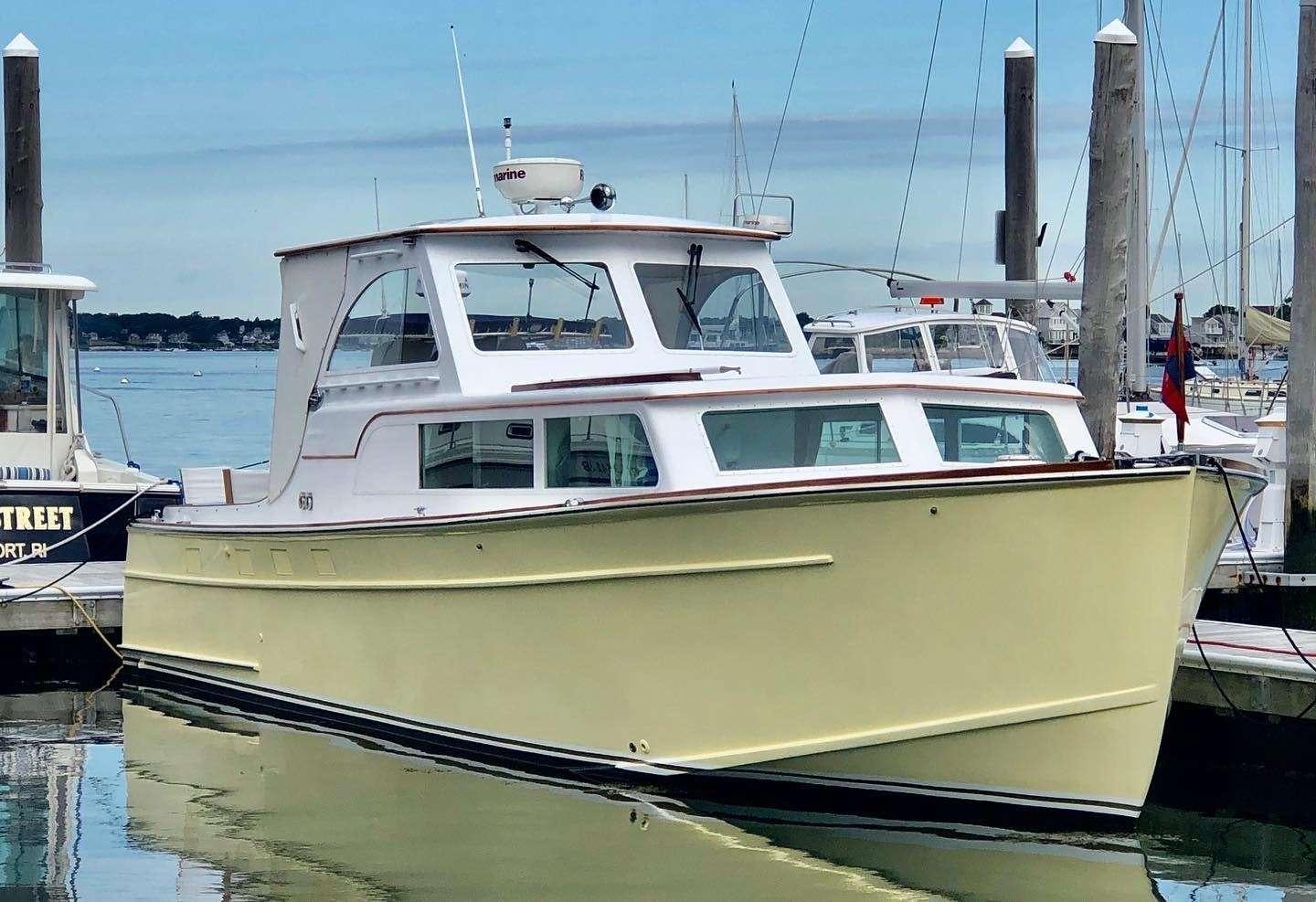 a boat docked at a pier aboard PEACEFUL Yacht for Charter