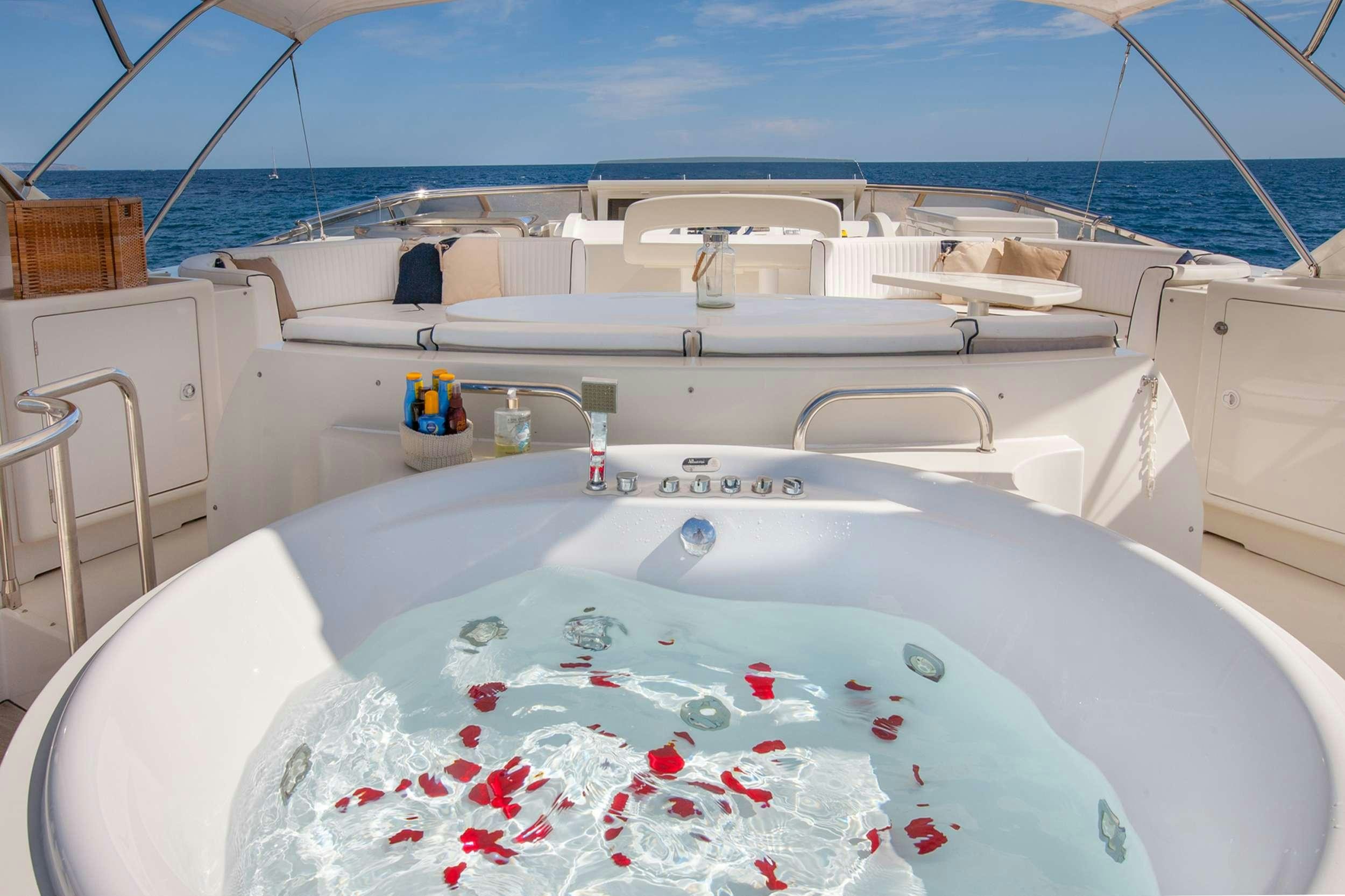 a white boat with red and white paint on it aboard WHITE FANG Yacht for Charter