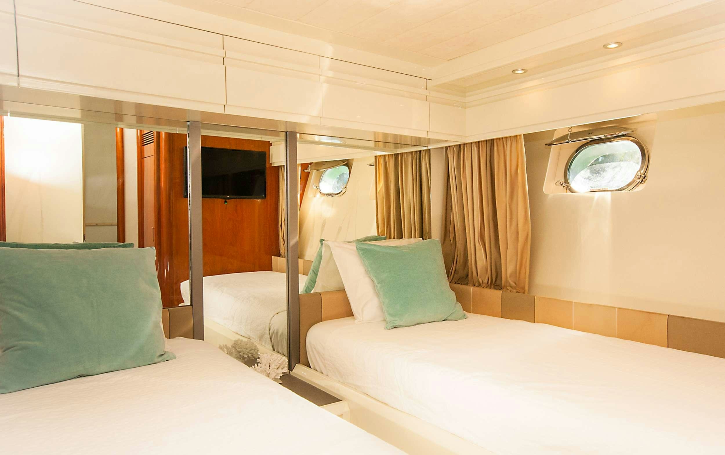 a room with two beds aboard WHITE FANG Yacht for Charter