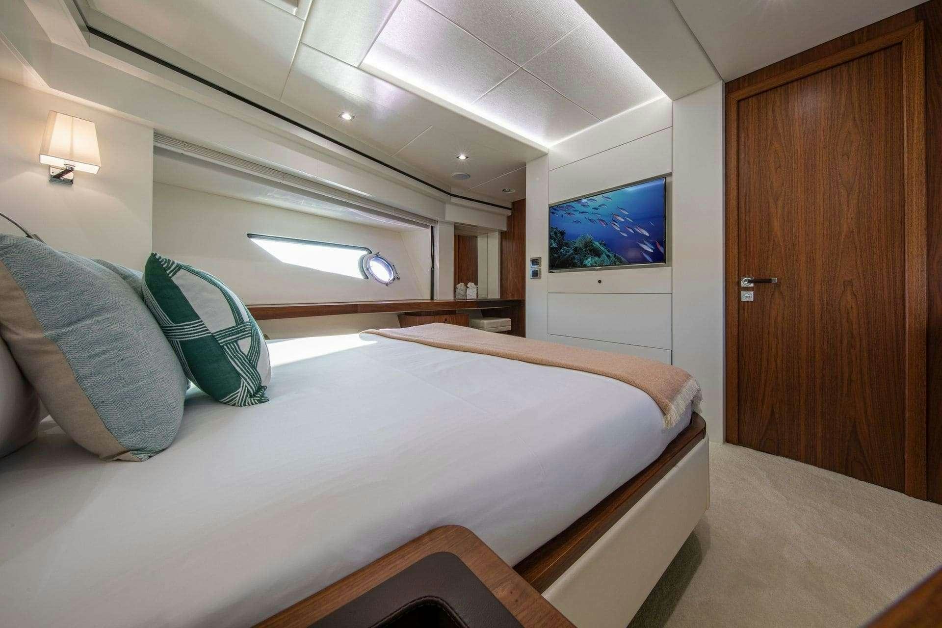 a bed in a room aboard RUSH X Yacht for Charter