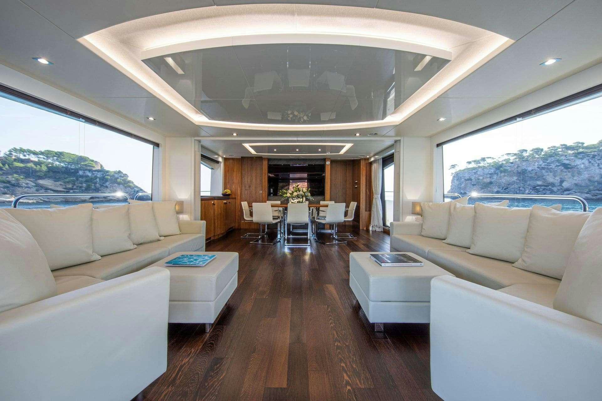 a living room with a large window aboard RUSH X Yacht for Charter