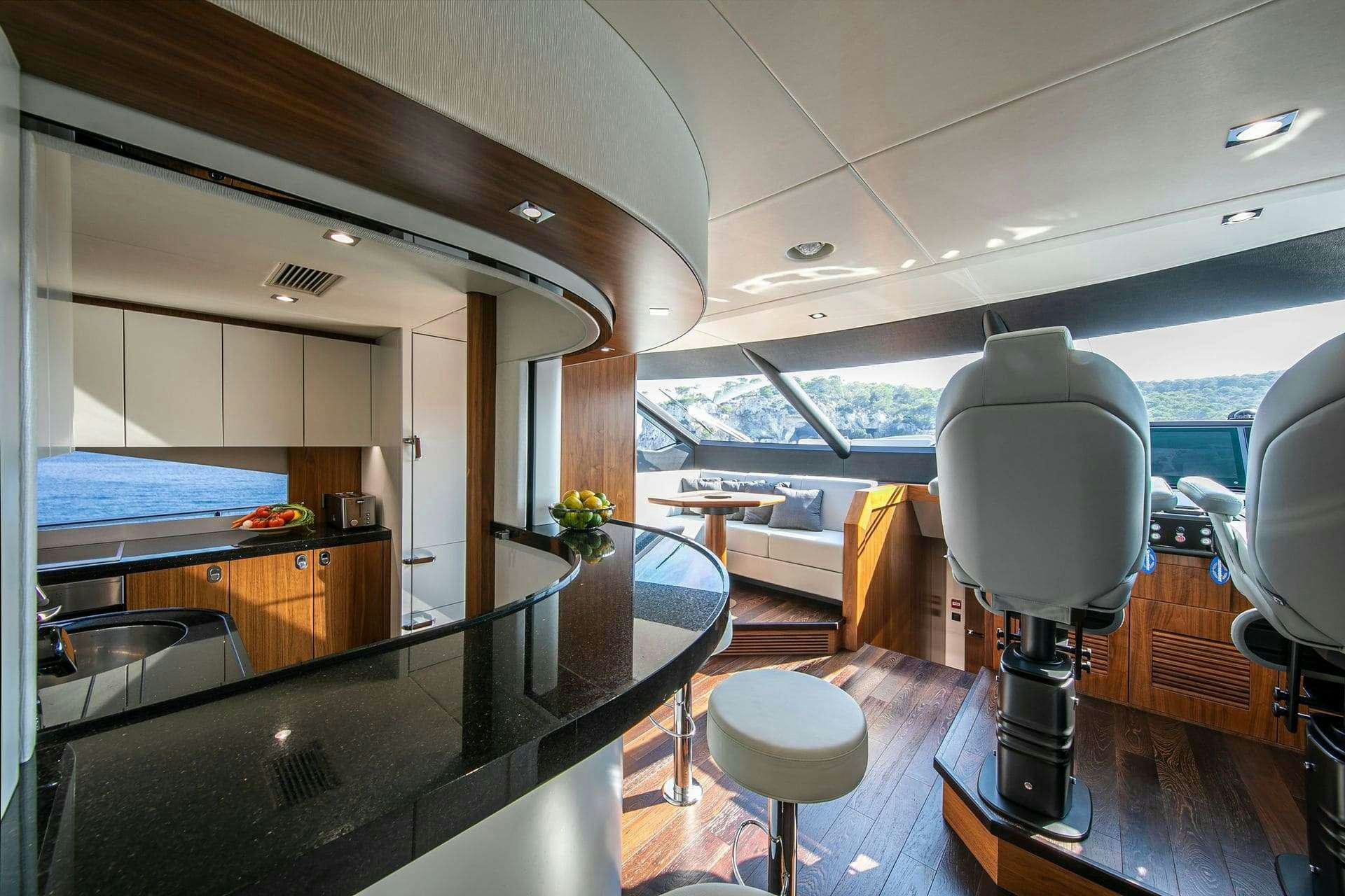 a room with a table and chairs aboard RUSH X Yacht for Charter