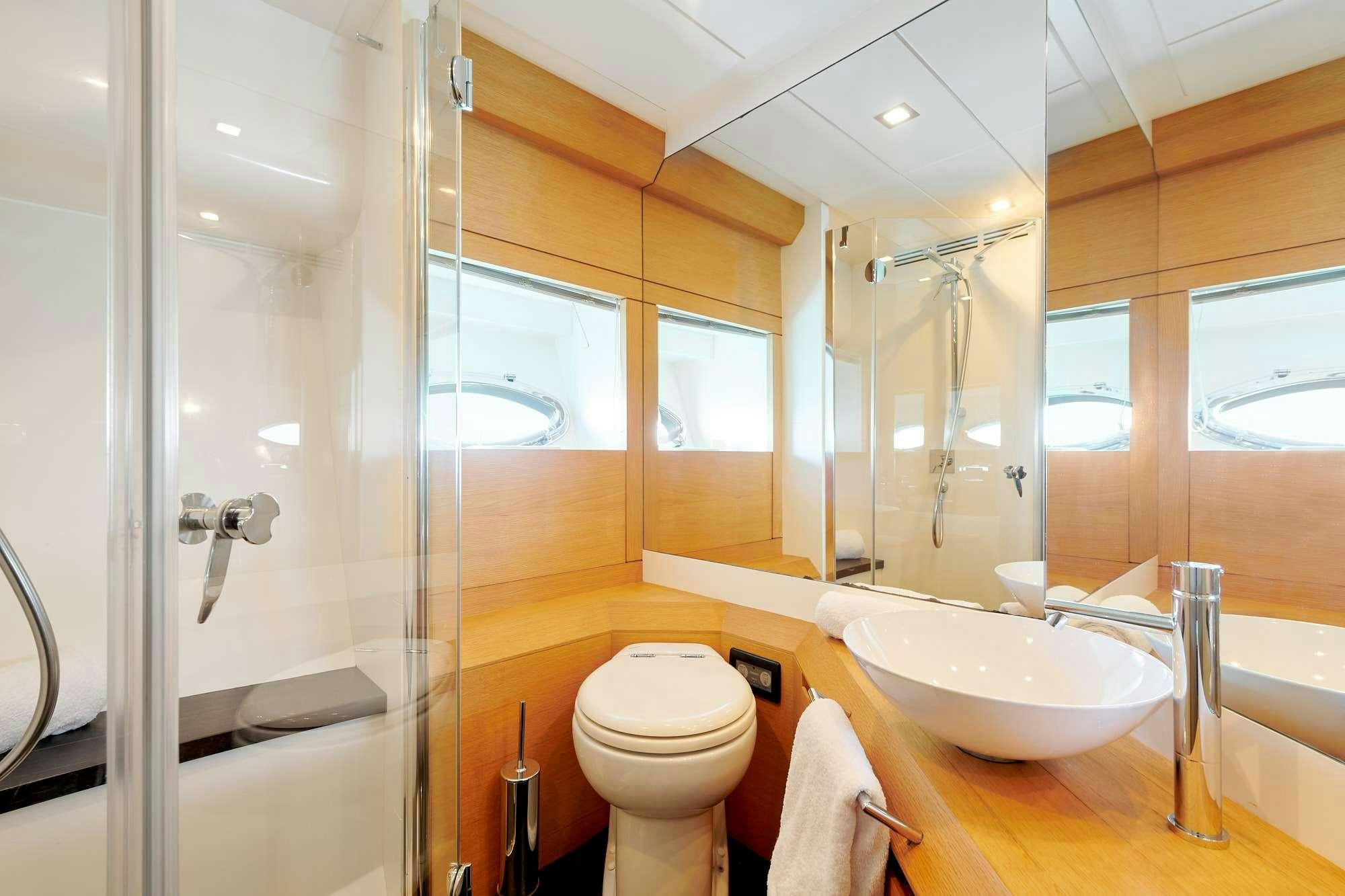 a bathroom with a glass shower aboard HALLEY Yacht for Charter