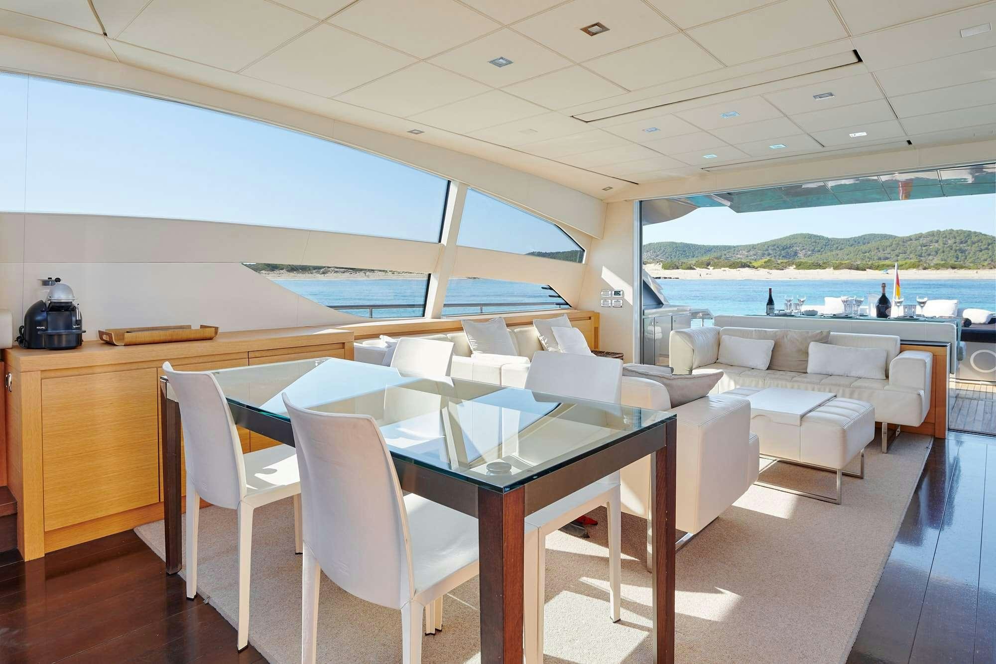a room with tables and chairs aboard HALLEY Yacht for Charter