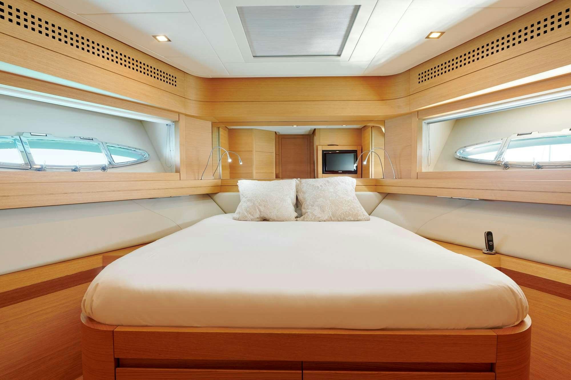 a bed in a room aboard HALLEY Yacht for Charter