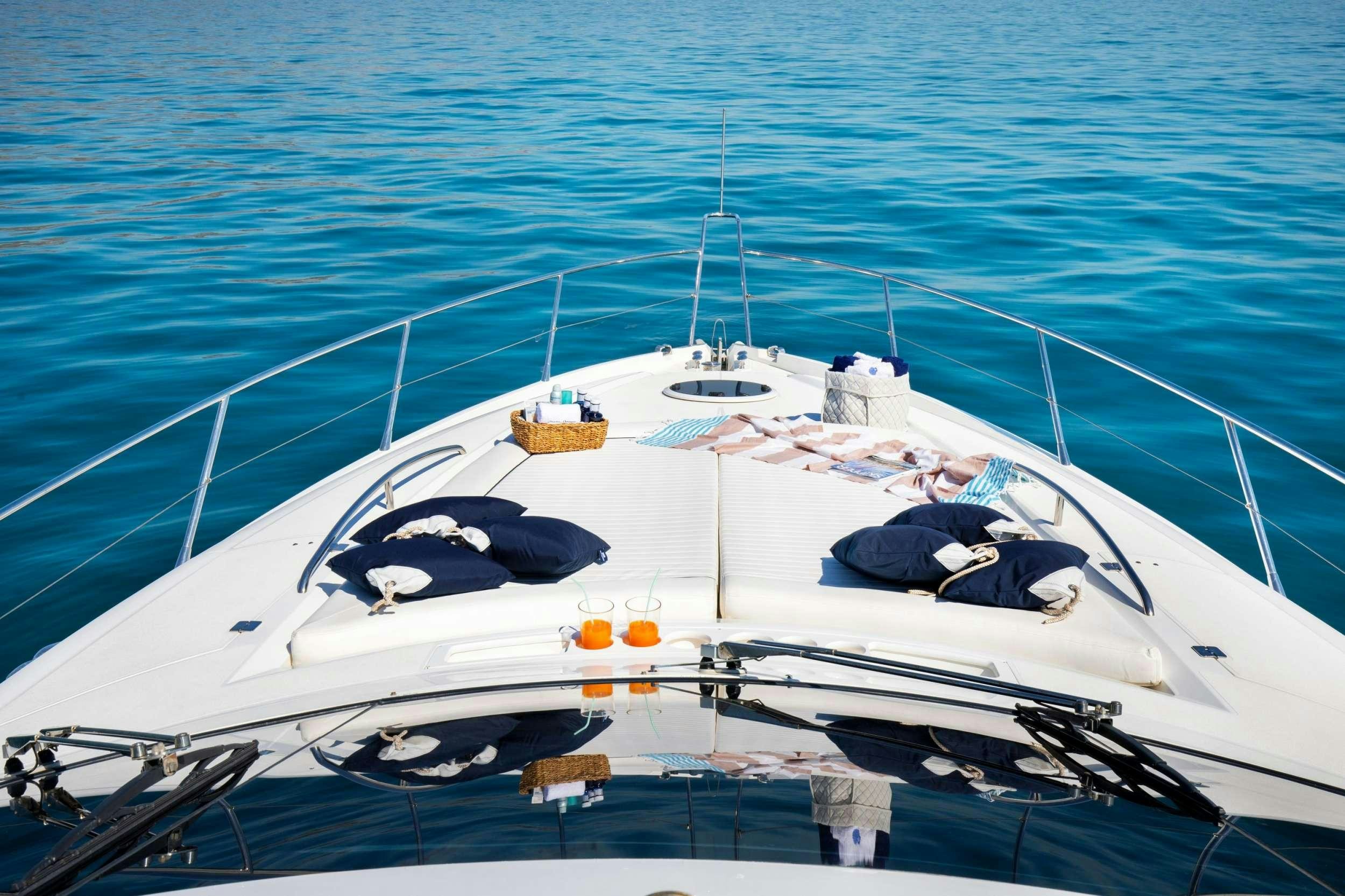 a white boat on the water aboard MEDITERRANI IV Yacht for Charter