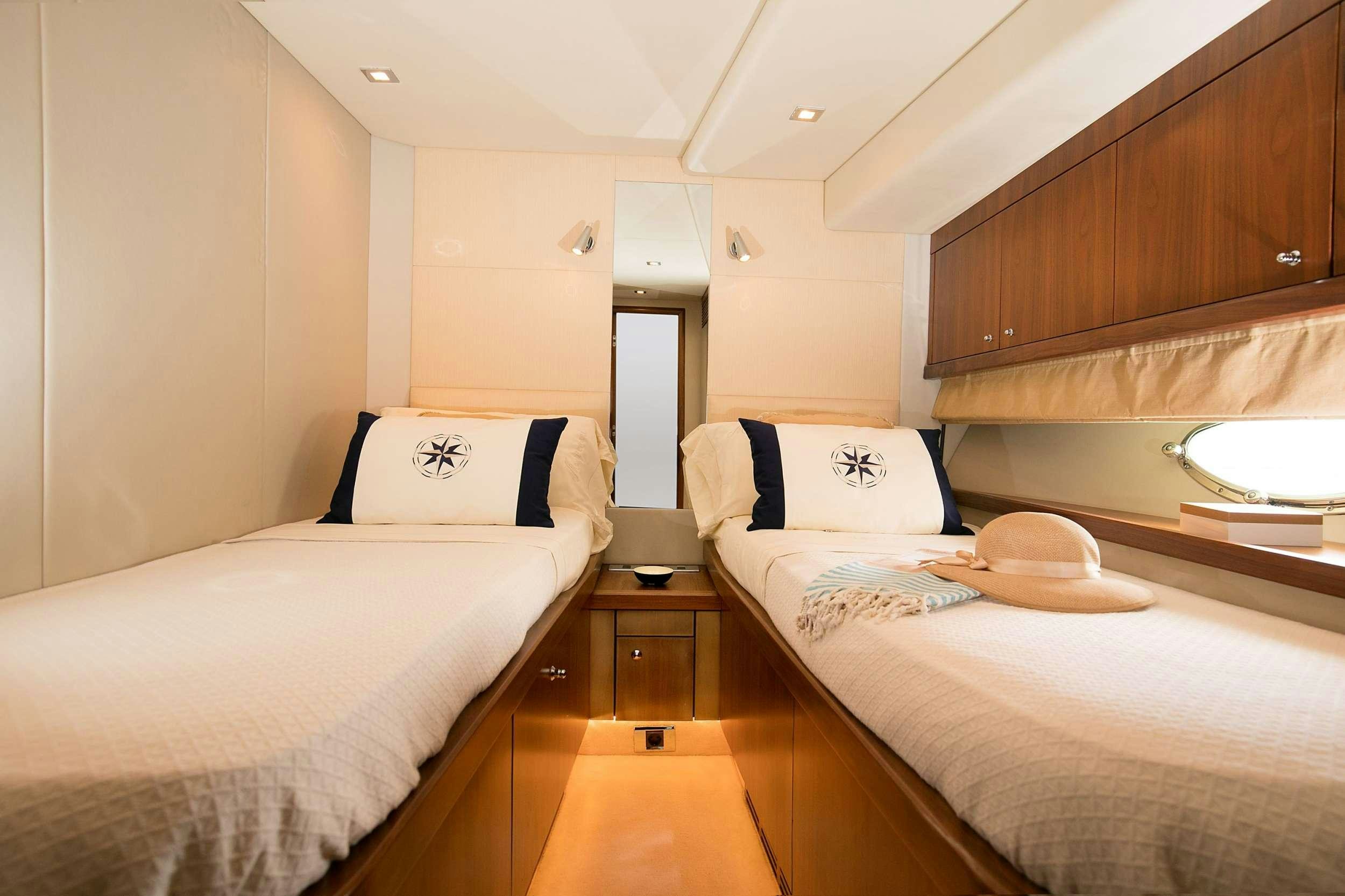 a room with two beds aboard MEDITERRANI IV Yacht for Charter