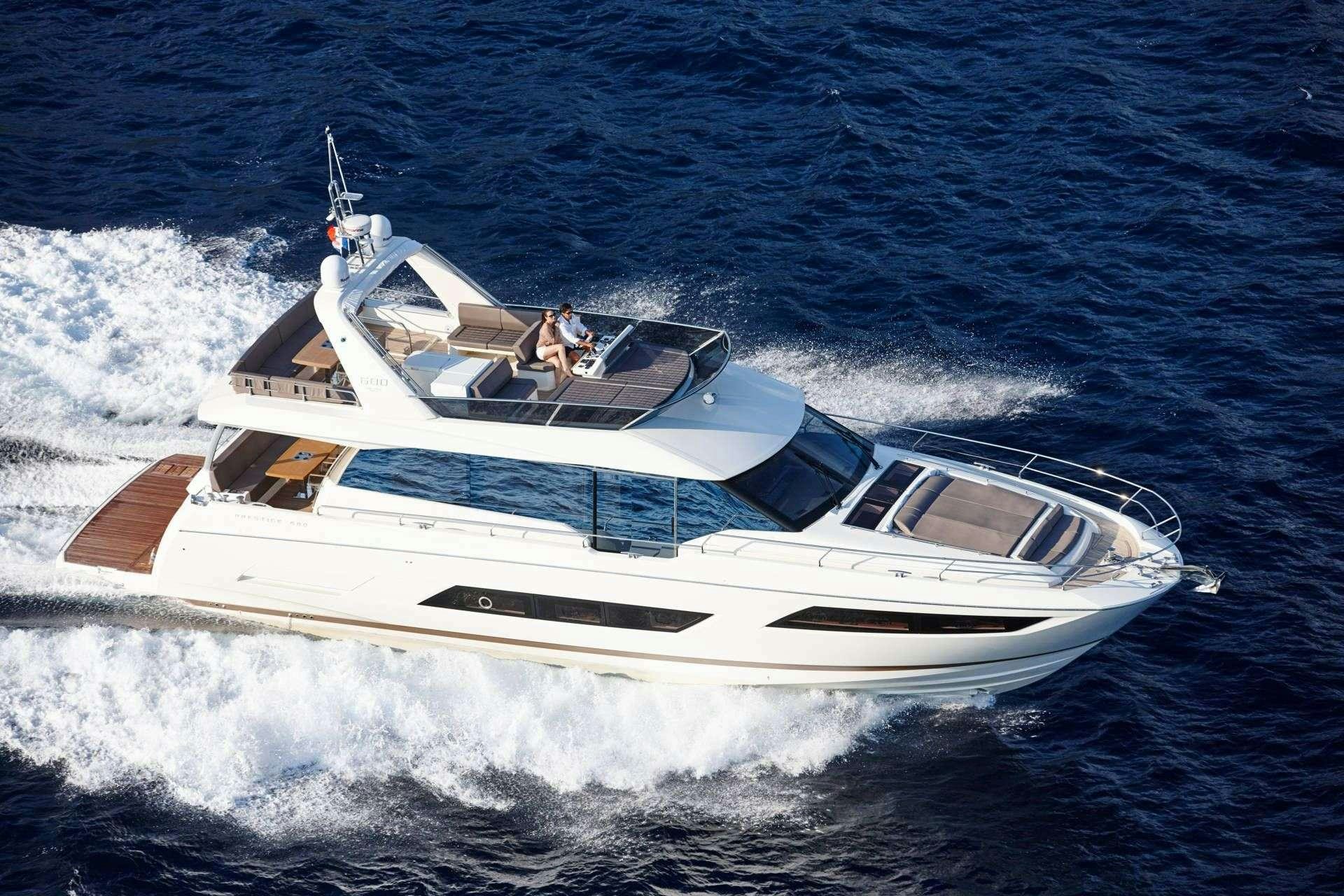 a white boat on the water aboard MO&EUML;T Yacht for Charter