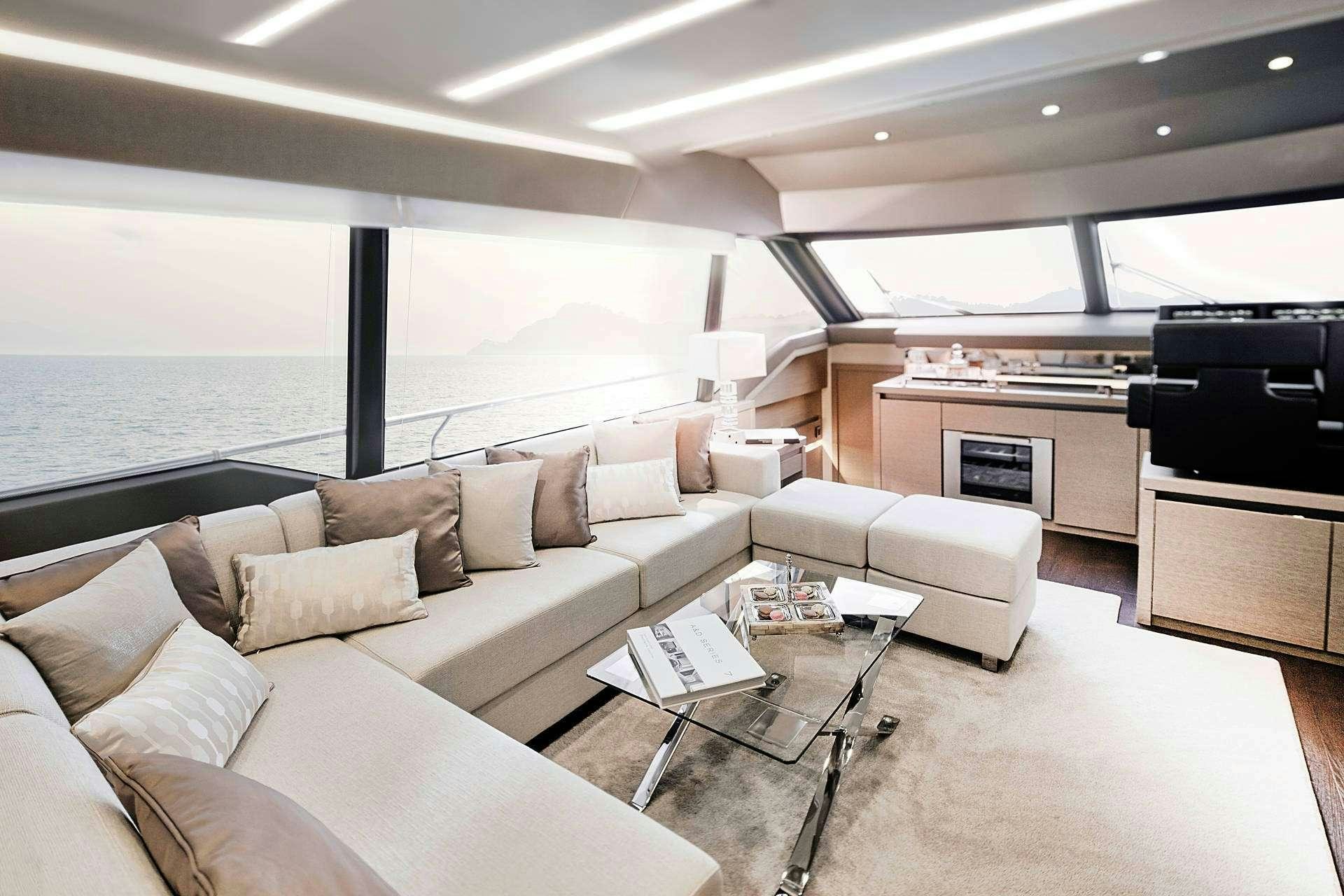 a living room with a large window aboard MO&EUML;T Yacht for Charter