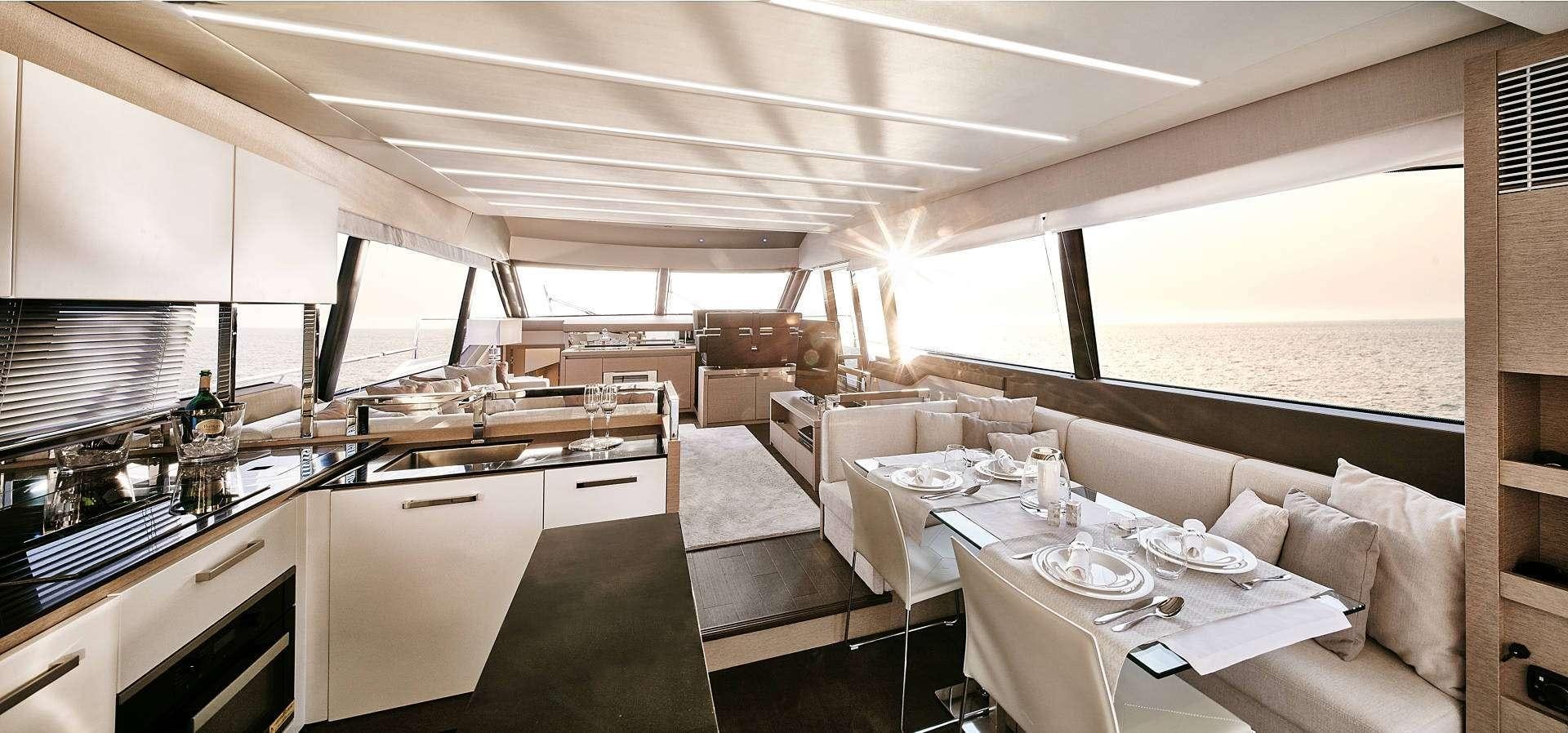 a large room with a table and chairs aboard MO&EUML;T Yacht for Charter