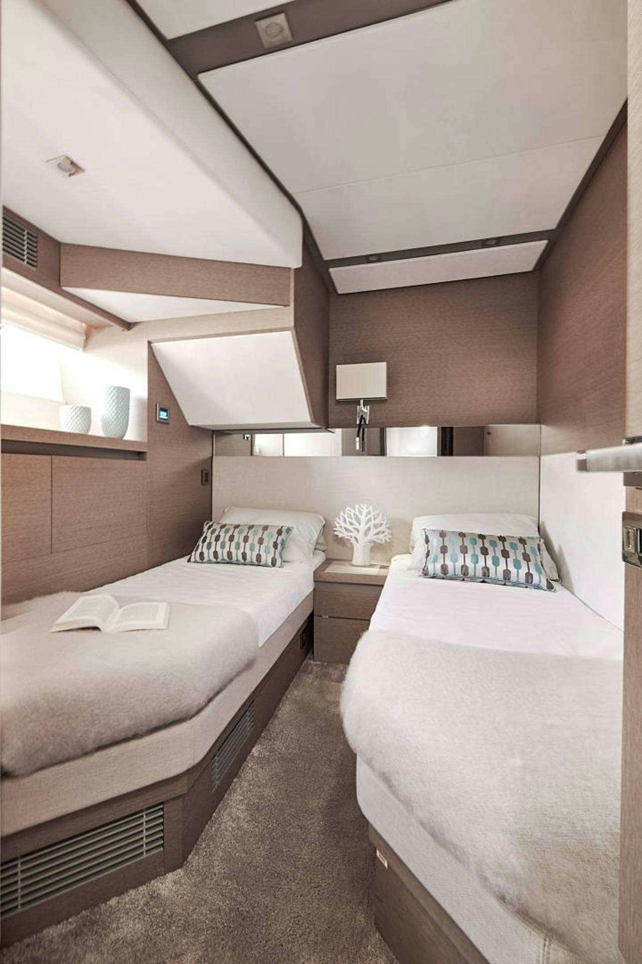 a room with two beds aboard MO&EUML;T Yacht for Charter