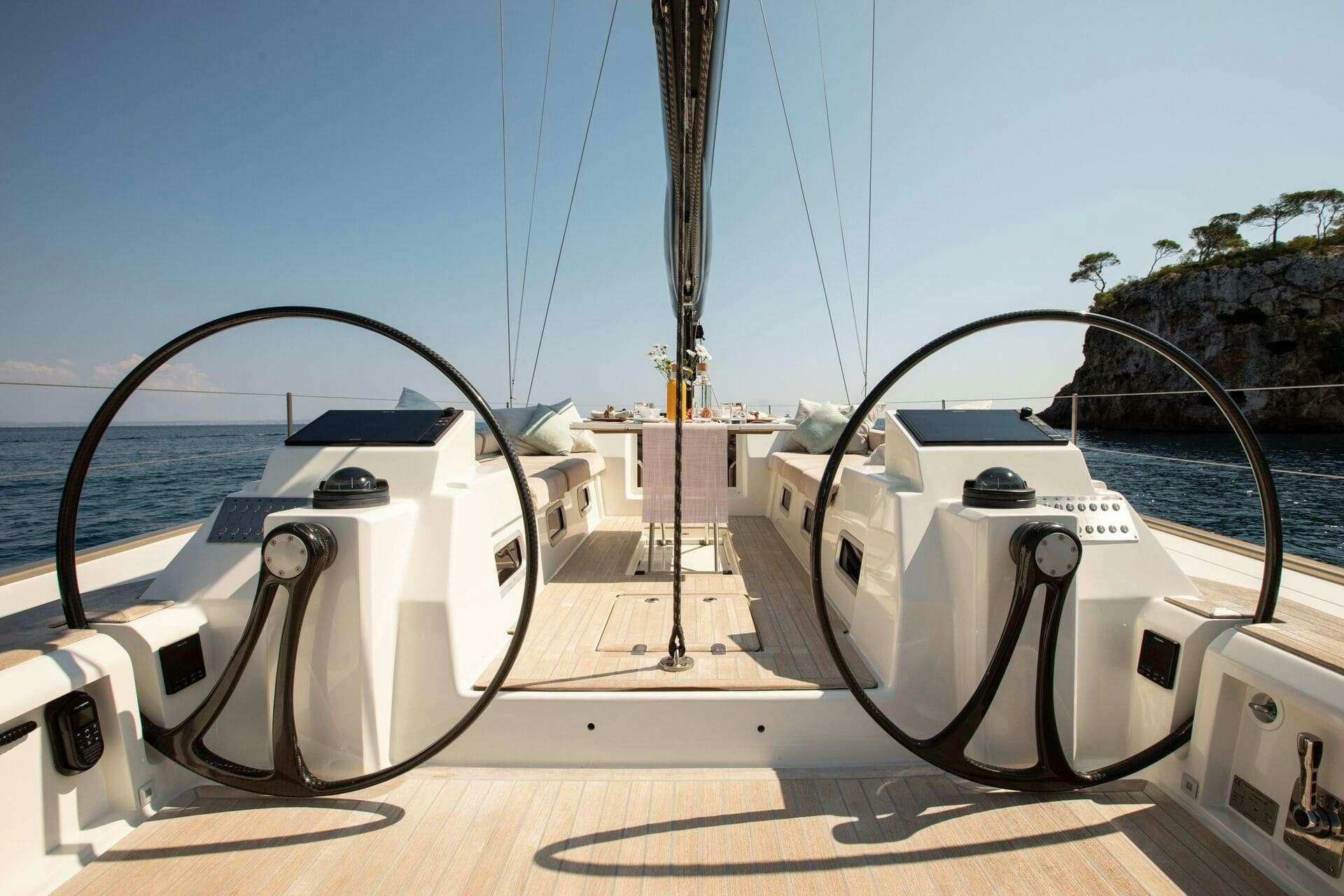 a large white machine on a wooden deck aboard MIYABI Yacht for Charter