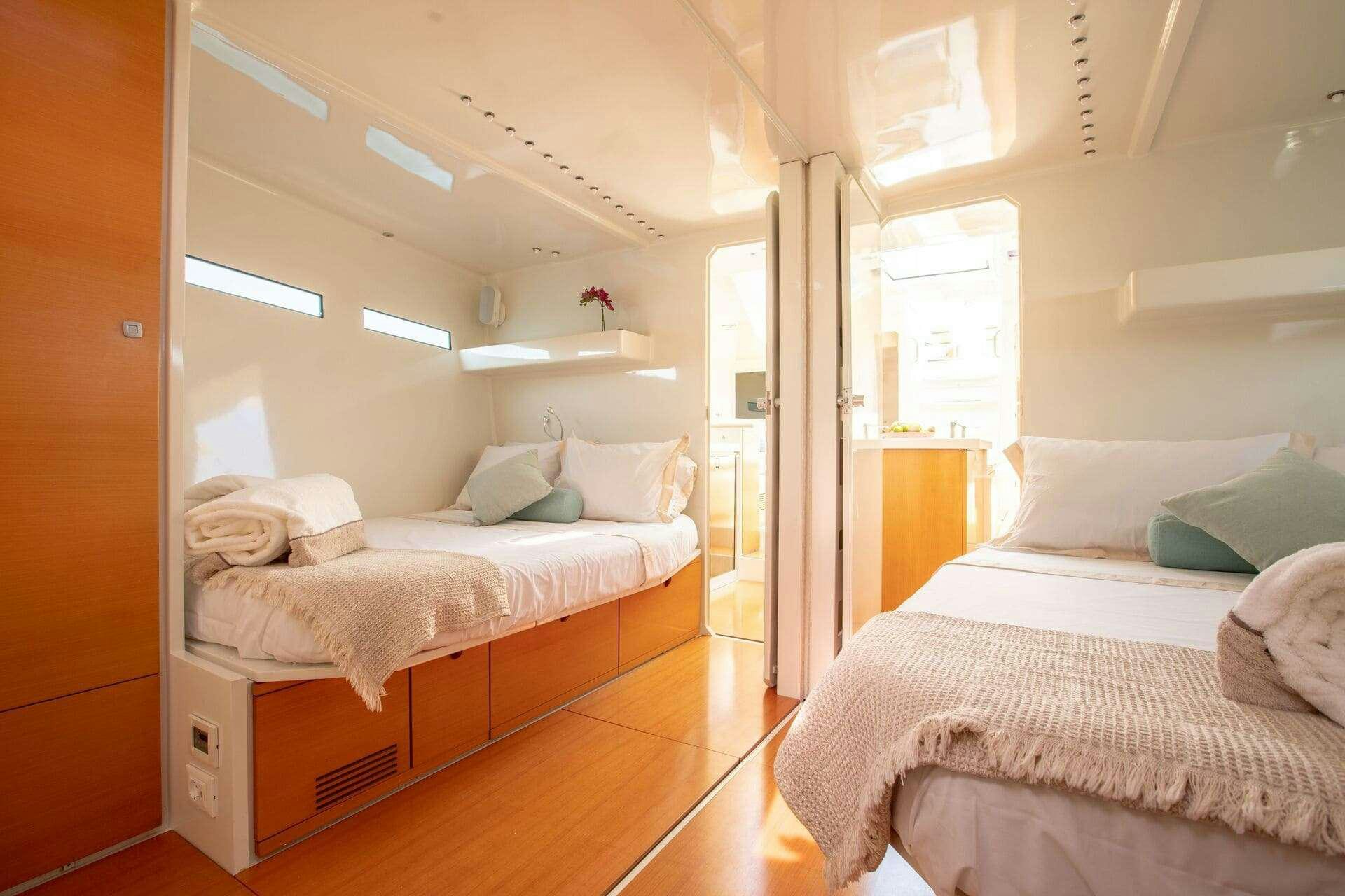 a room with two beds aboard MIYABI Yacht for Charter