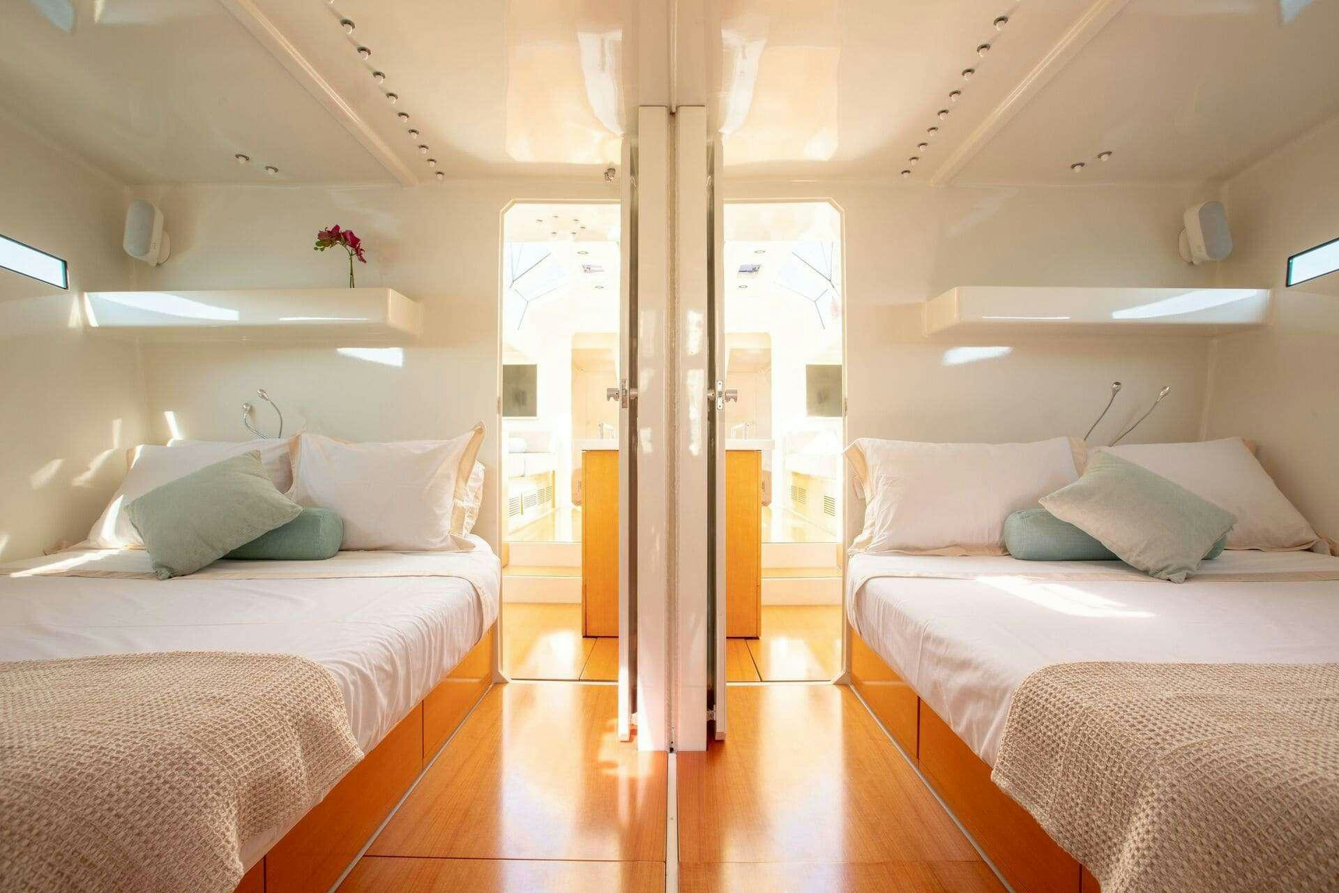 a room with two beds aboard MIYABI Yacht for Charter
