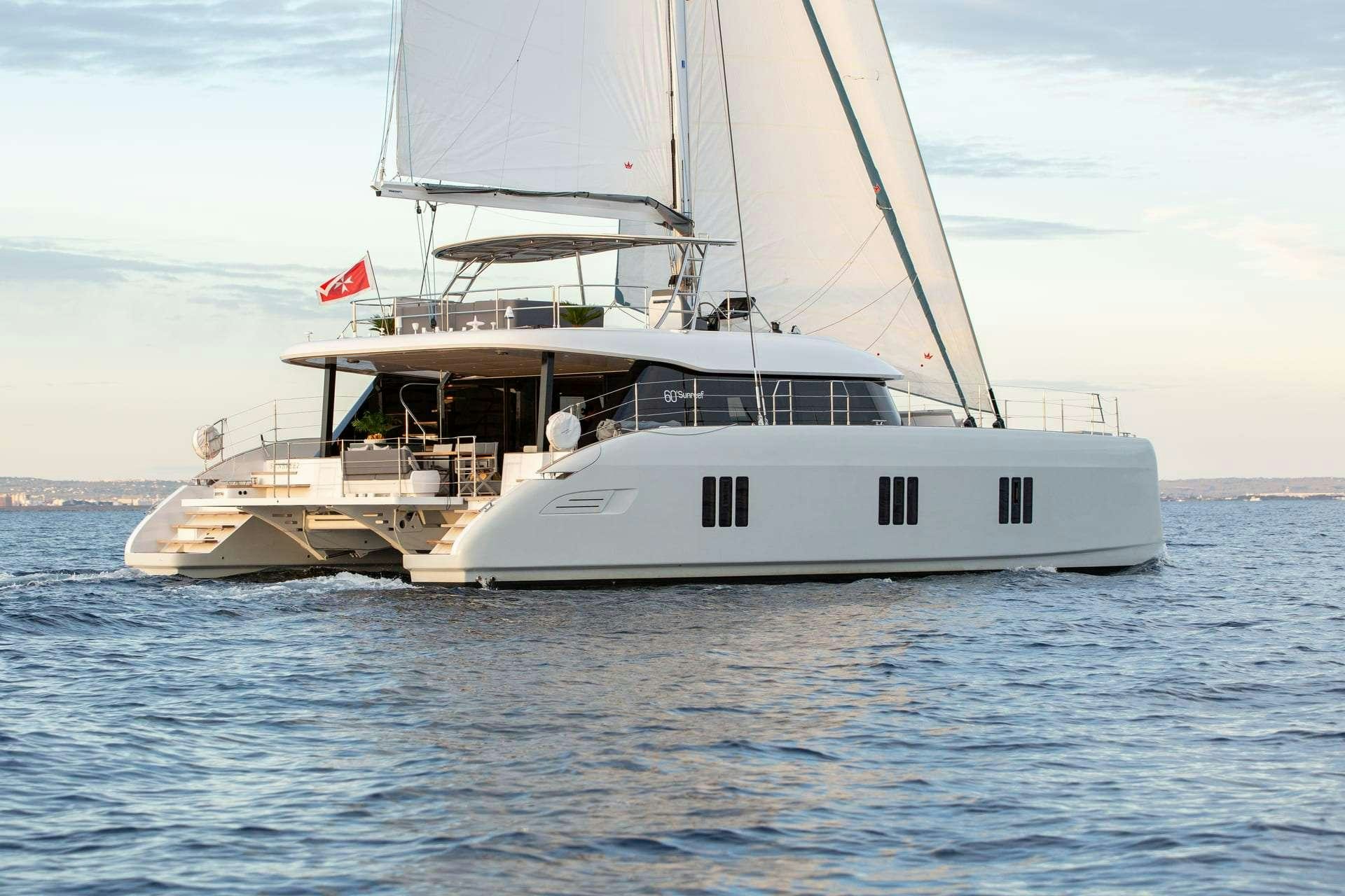 a white boat in the water aboard SUNBREEZE Yacht for Charter