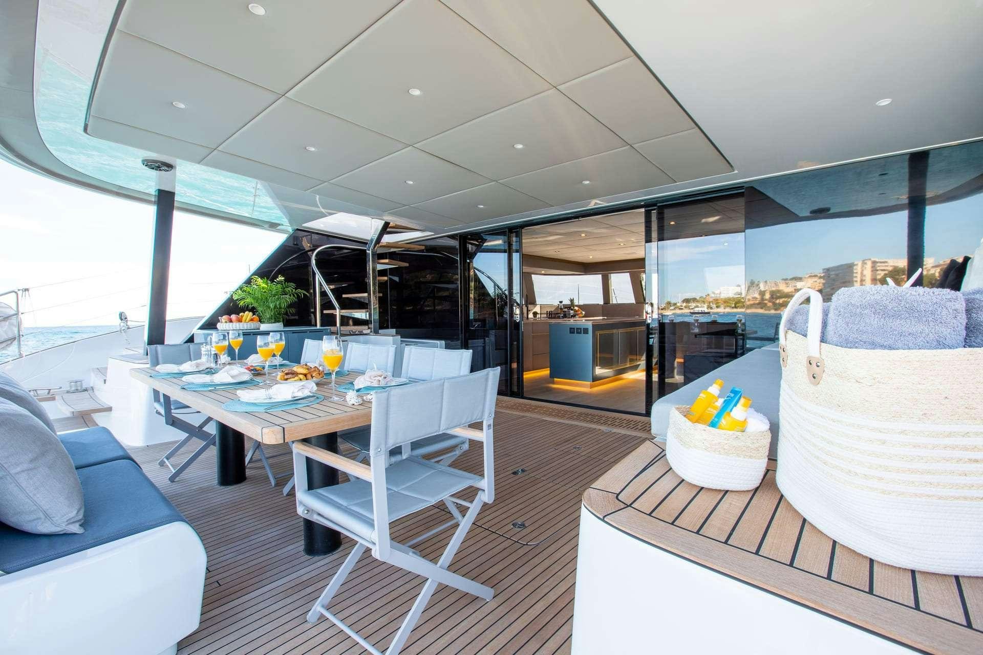 a room with a table and chairs aboard SUNBREEZE Yacht for Charter