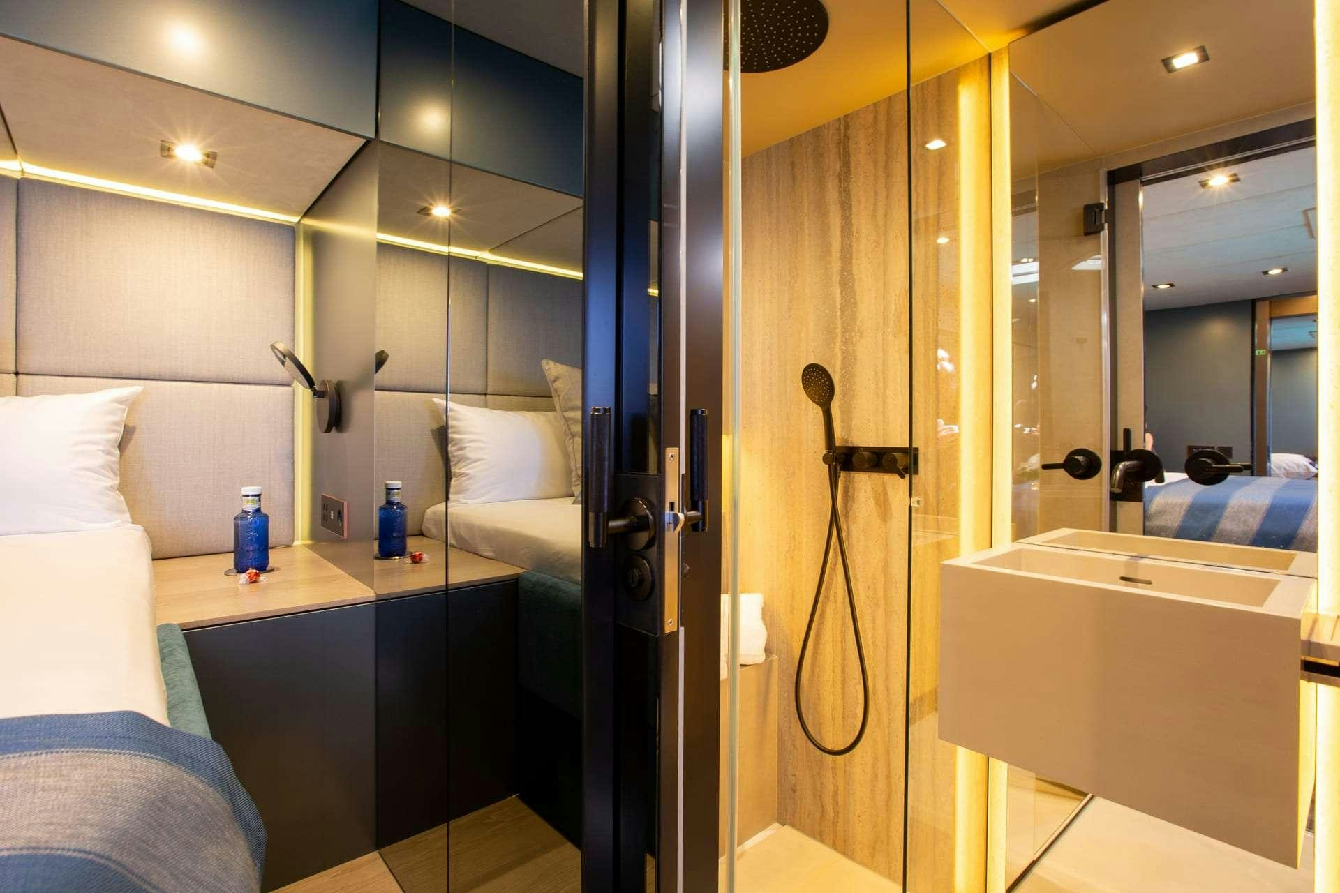 a bathroom with a shower and sink aboard SUNBREEZE Yacht for Charter