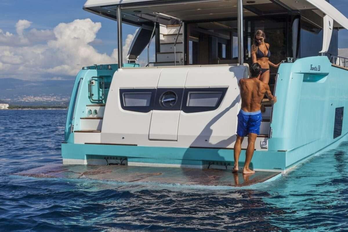 a couple of people on a boat aboard MAYBE5 Yacht for Charter