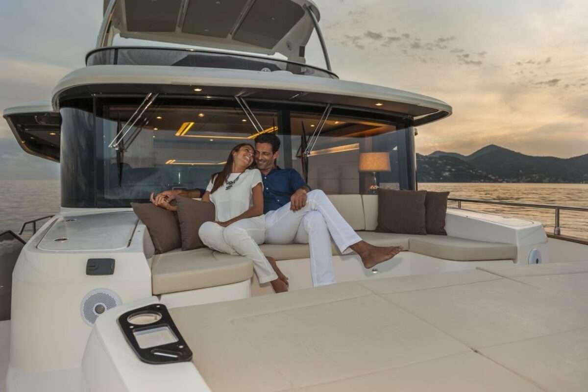 a group of people sitting in a convertible car aboard MAYBE5 Yacht for Charter