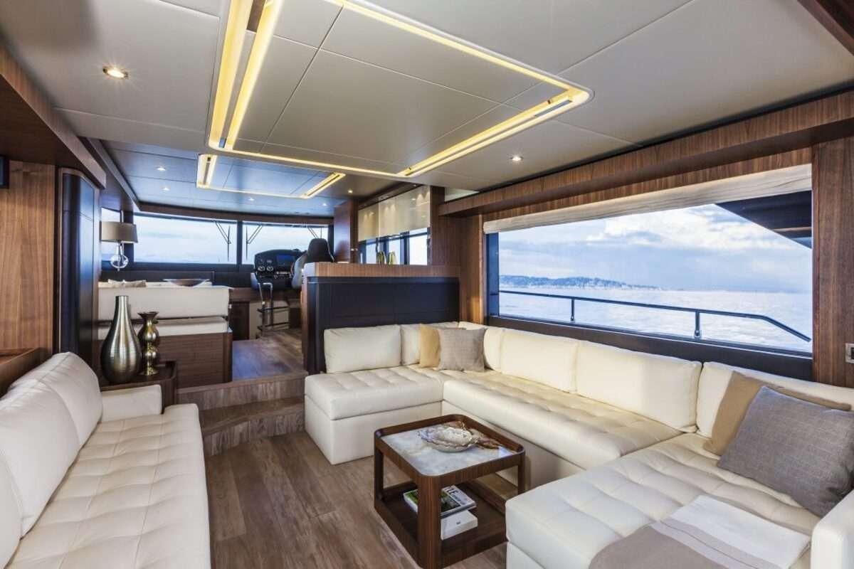 a living room with a large window aboard MAYBE5 Yacht for Charter