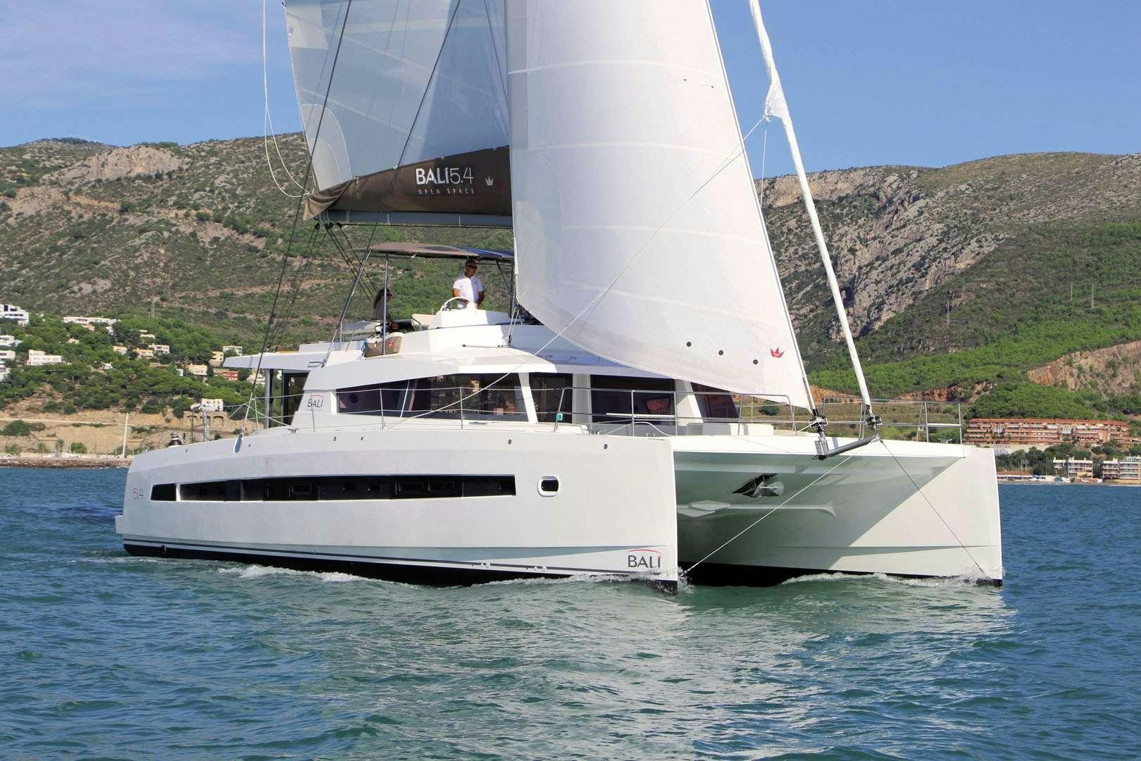 a white boat on the water aboard AMURA Yacht for Charter