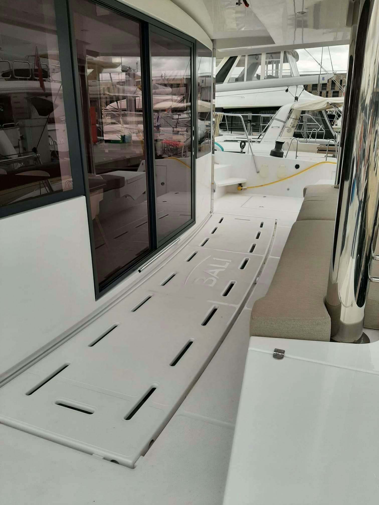 a white machine with a screen aboard AMURA Yacht for Charter