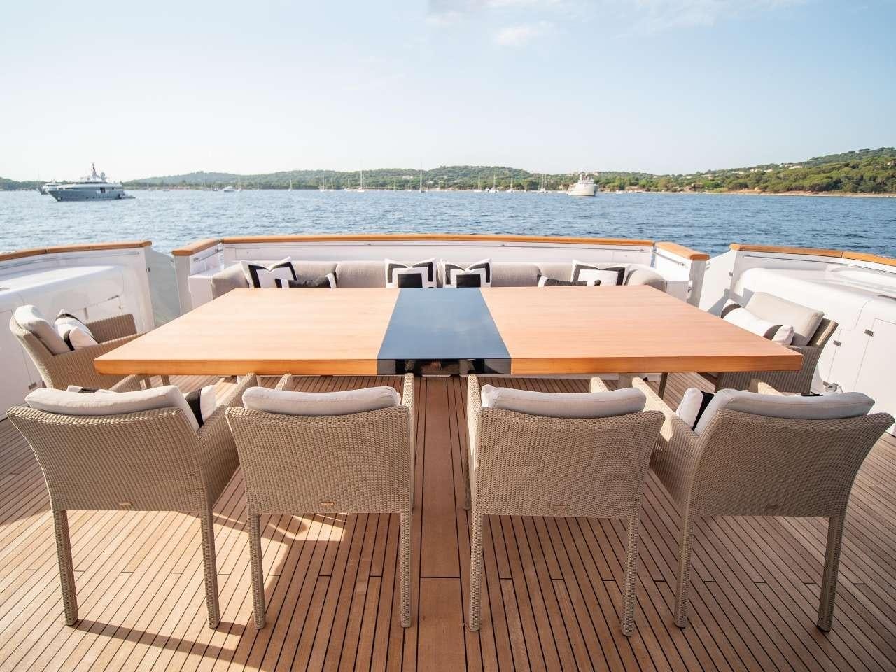 a table set up for a meal aboard M Yacht for Charter