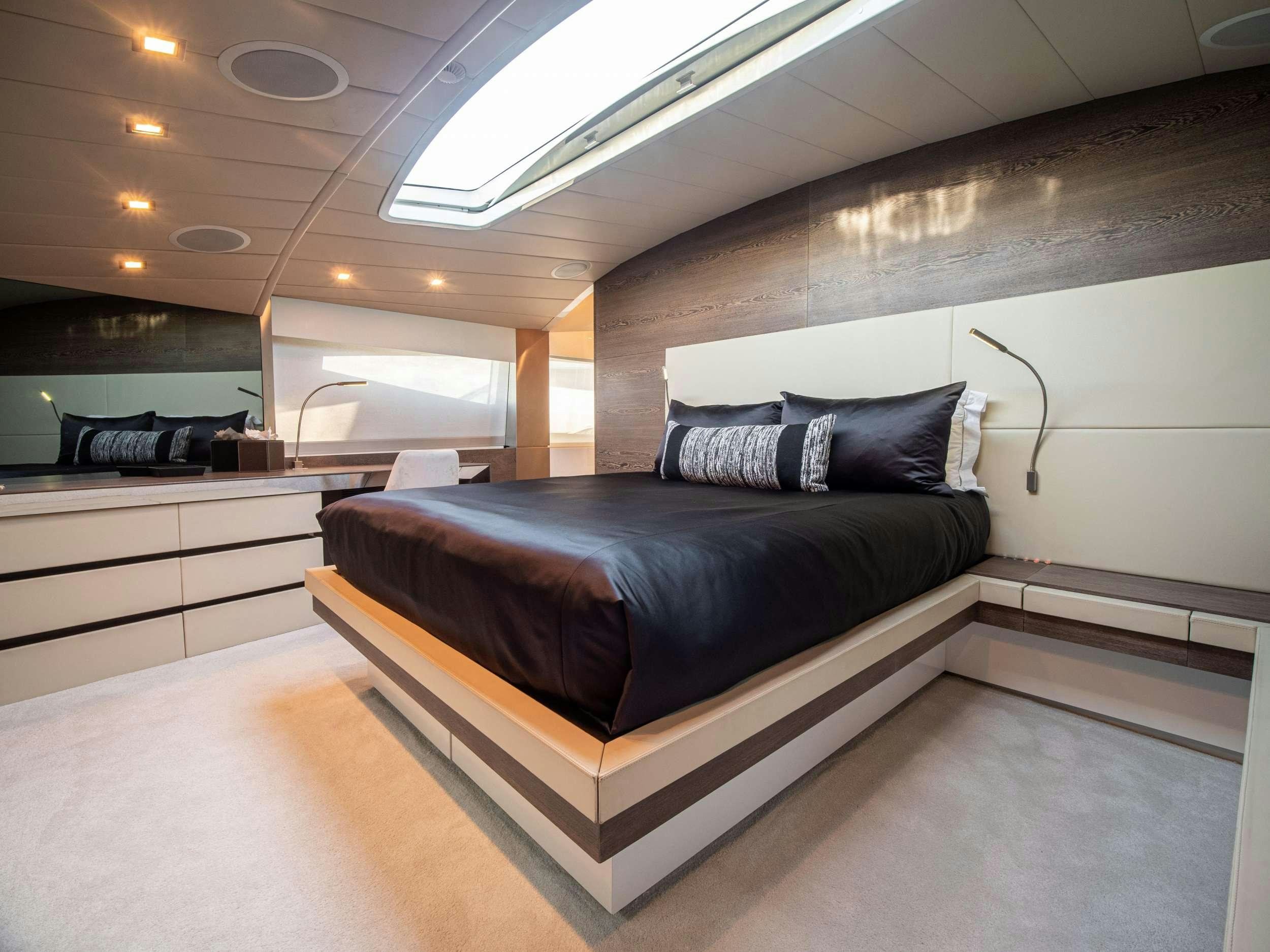 a bed in a room aboard M Yacht for Charter