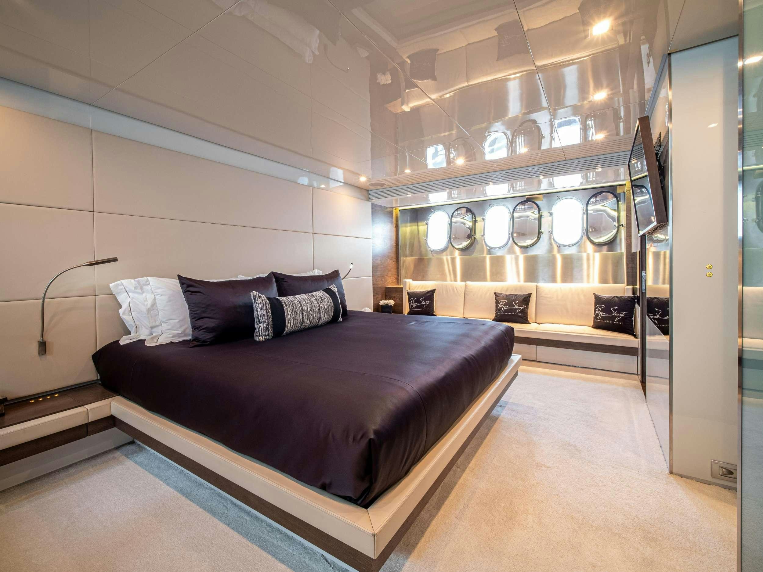 a bed in a room aboard M Yacht for Charter
