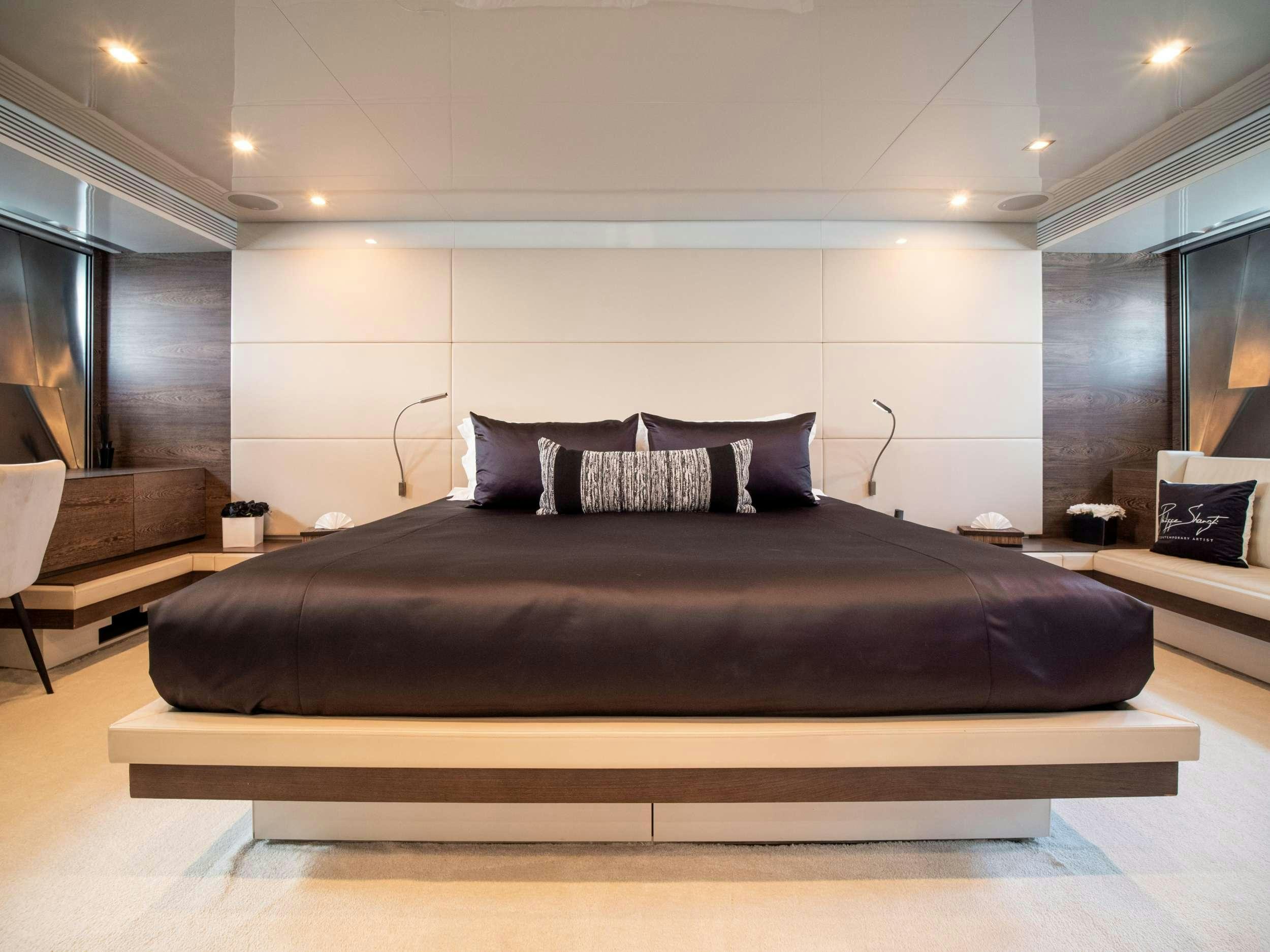 a large bed in a room aboard M Yacht for Charter