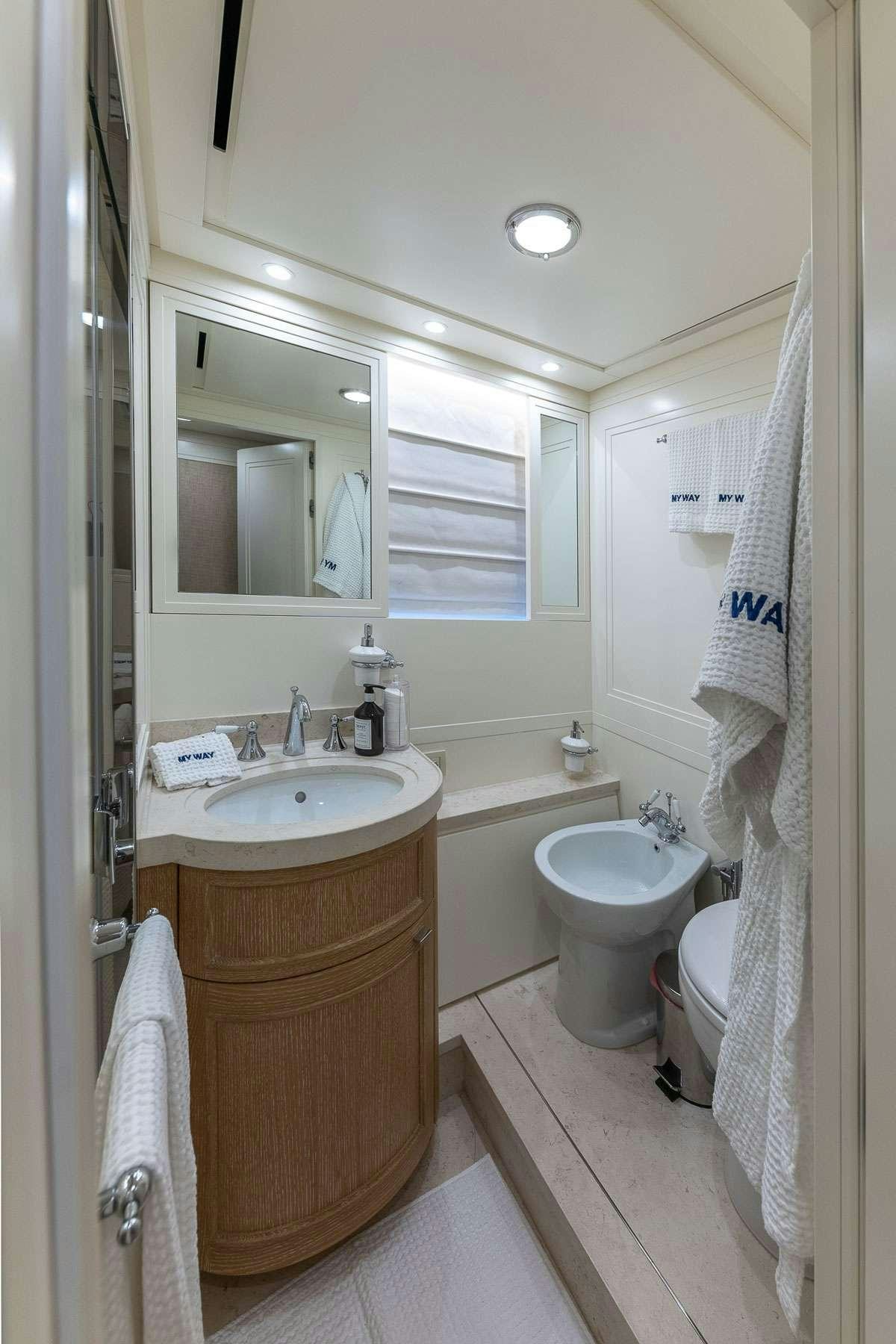 a bathroom with a sink and toilet aboard MY WAY Yacht for Charter