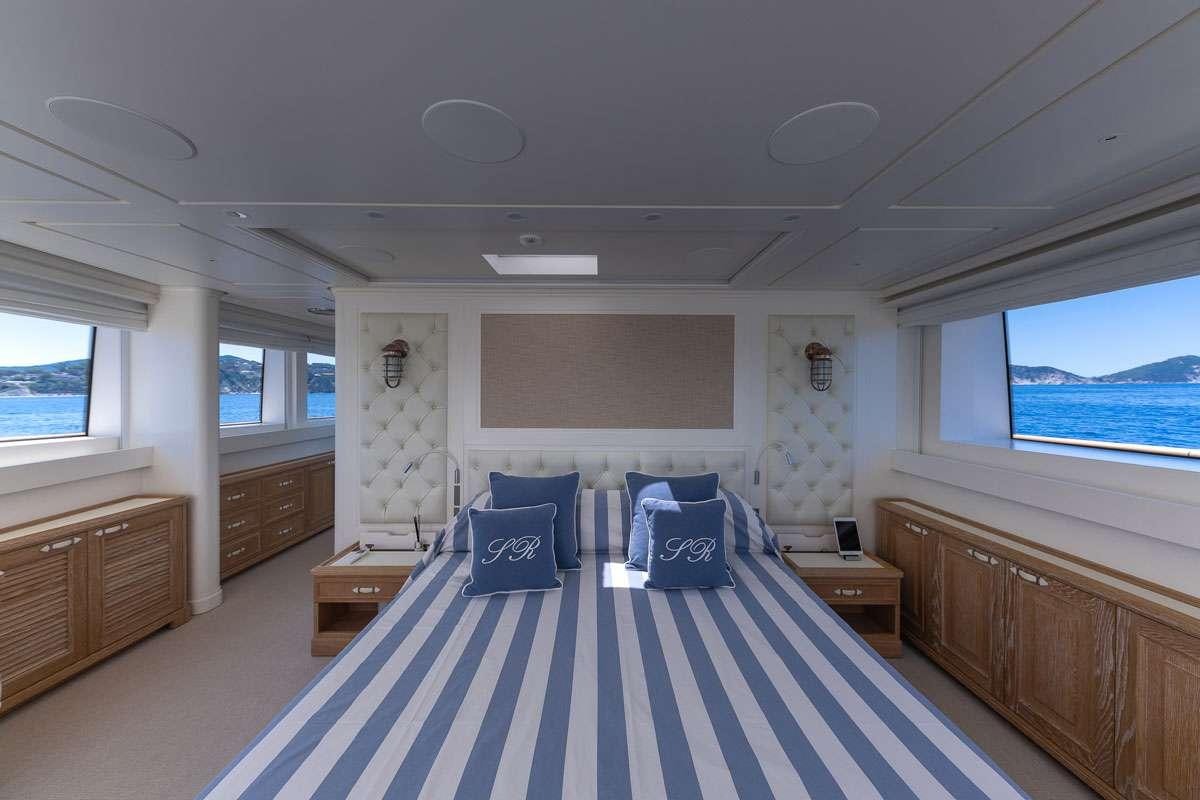 a bedroom with a large bed aboard MY WAY Yacht for Charter
