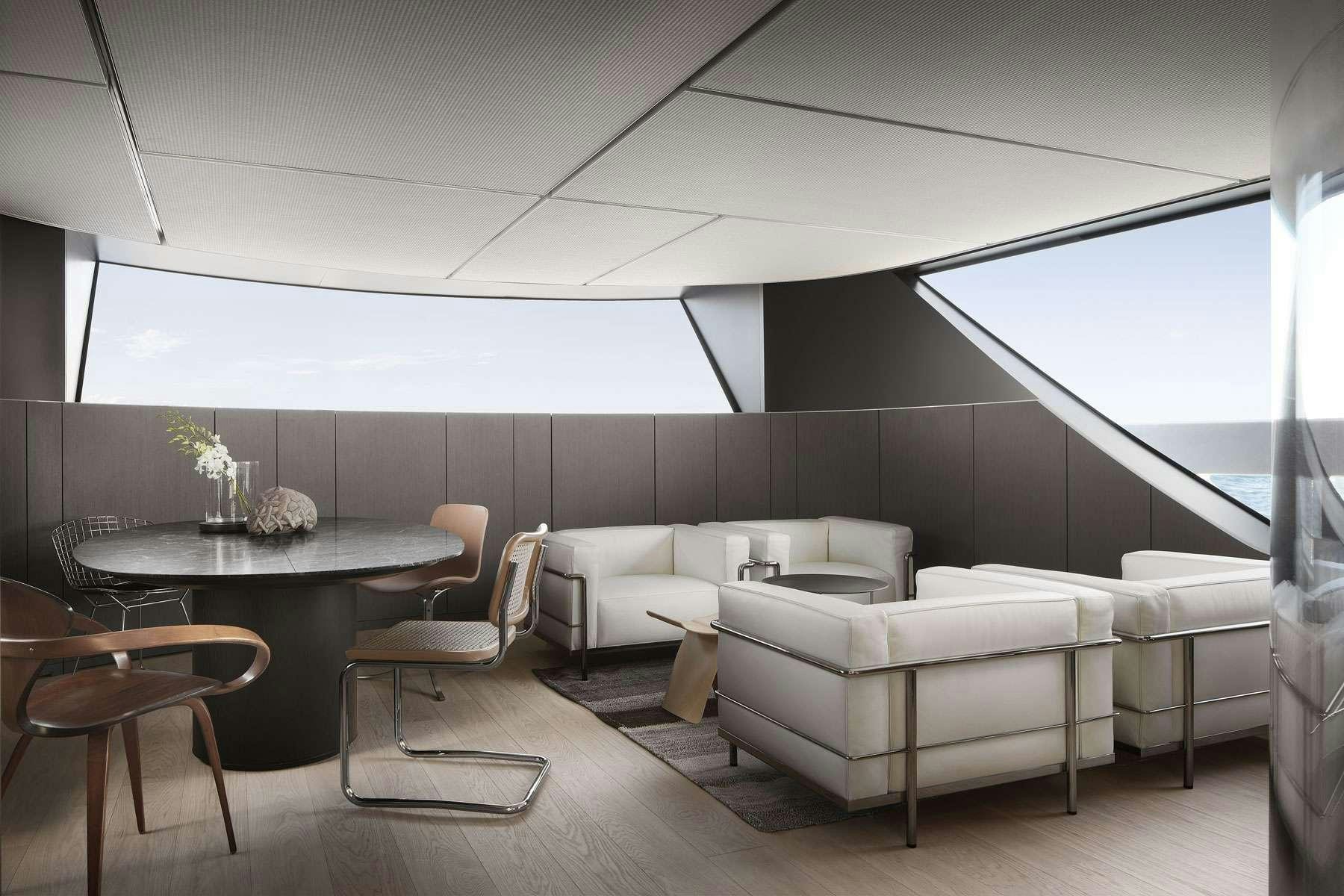 a room with a table and chairs aboard ALMAX Yacht for Charter