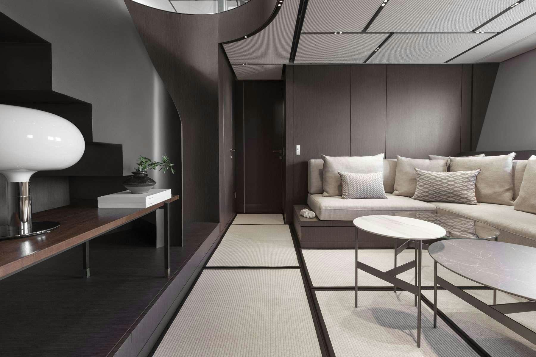 a room with a couch and a table aboard ALMAX Yacht for Charter