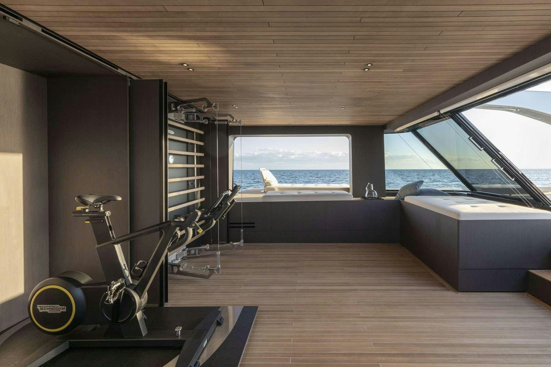 a room with a large window and a large projector screen aboard ALMAX Yacht for Charter