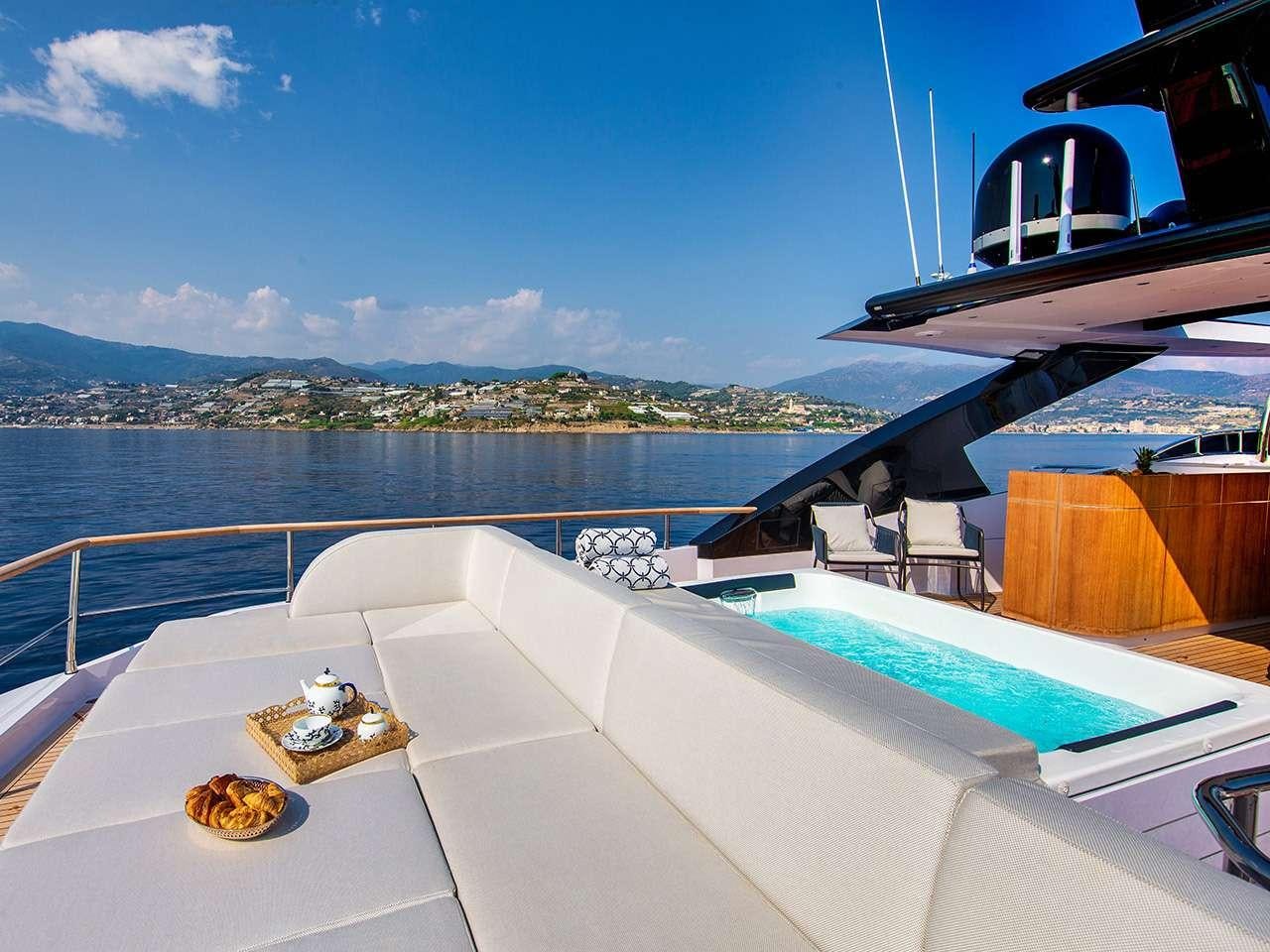 a balcony overlooking a body of water aboard ARSANA Yacht for Charter