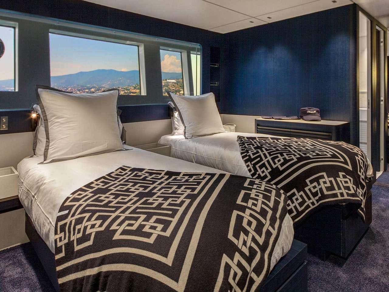a couple of beds in a room aboard ARSANA Yacht for Charter