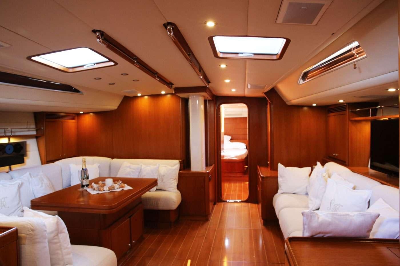 a room with a table and couches aboard SOUTHERN STAR Yacht for Charter