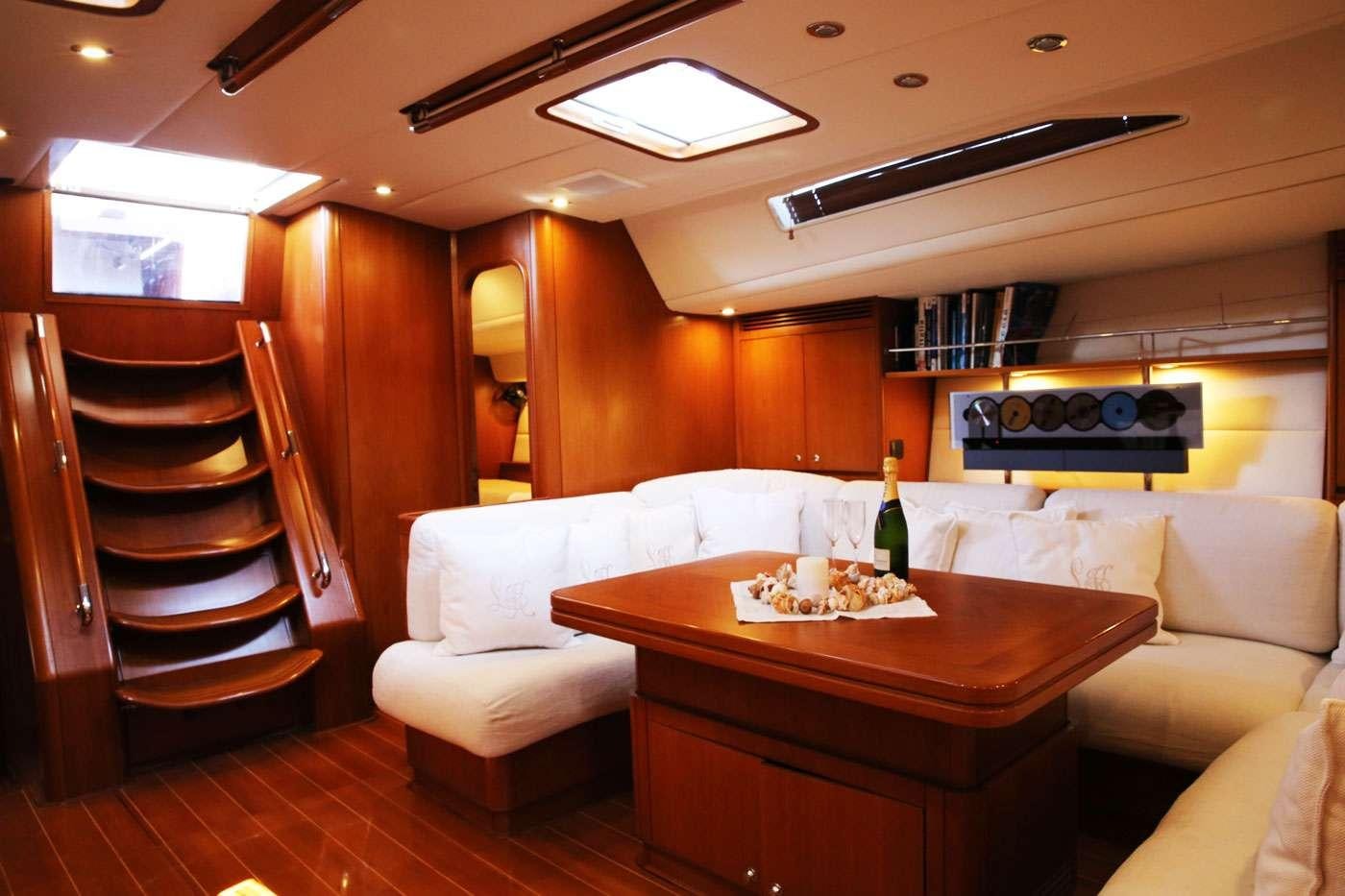 a room with a couch and a table aboard SOUTHERN STAR Yacht for Charter