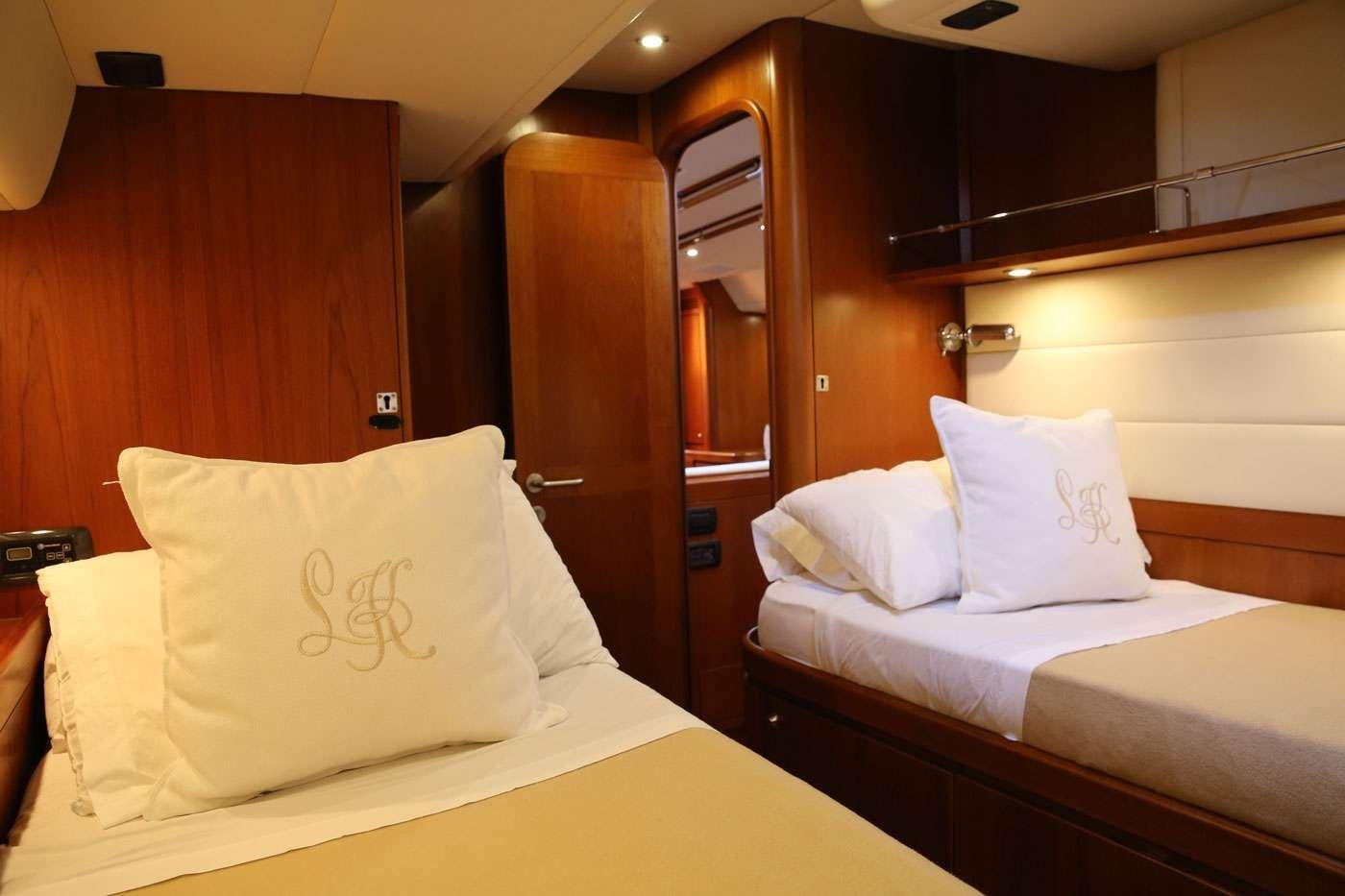 a couple of beds in a hotel room aboard SOUTHERN STAR Yacht for Charter