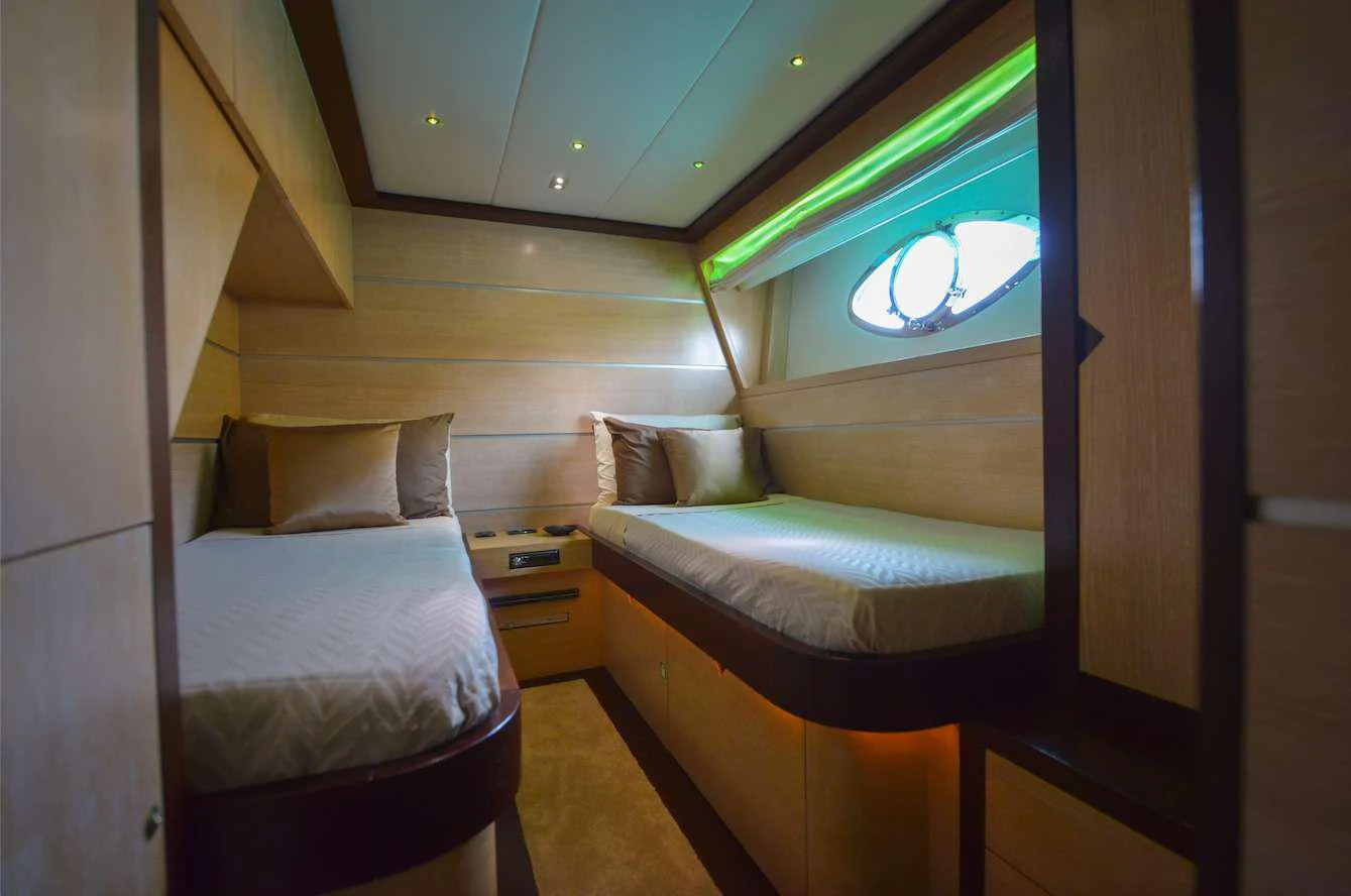 a room with two beds aboard BLACK MAGIC Yacht for Charter