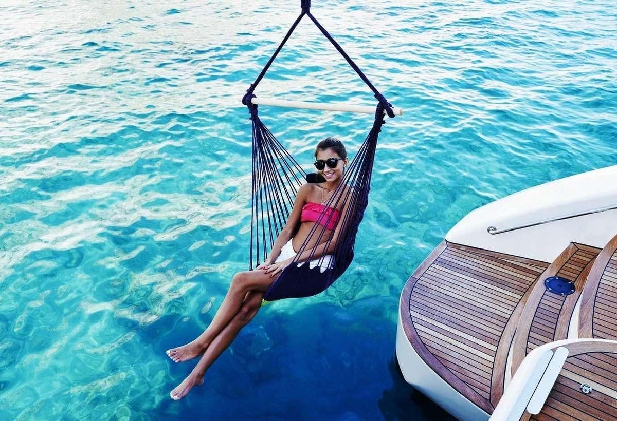 a person on a sailboat aboard 19TH HOLE Yacht for Charter