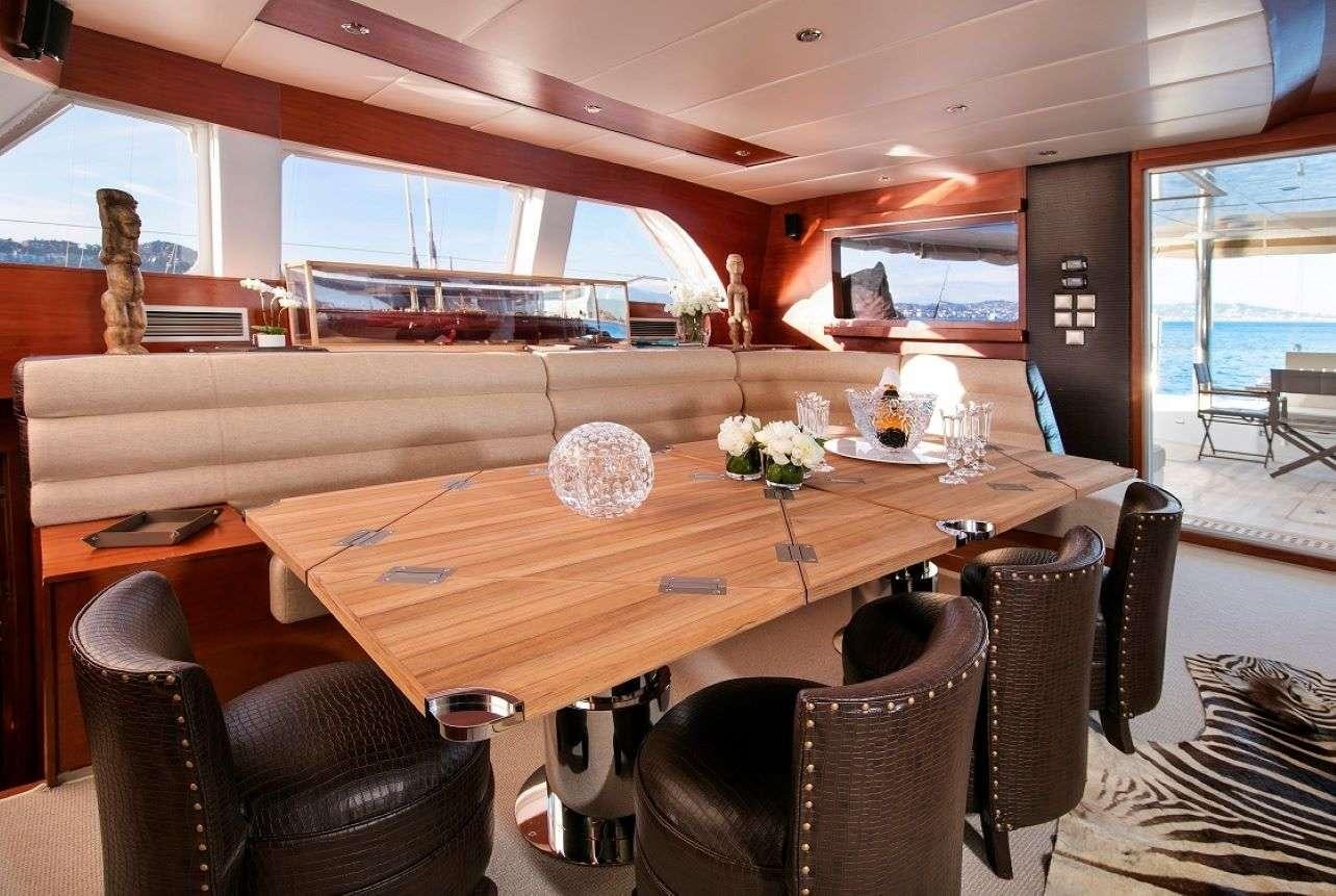 a dining table in a room aboard Free Spirit Yacht for Charter