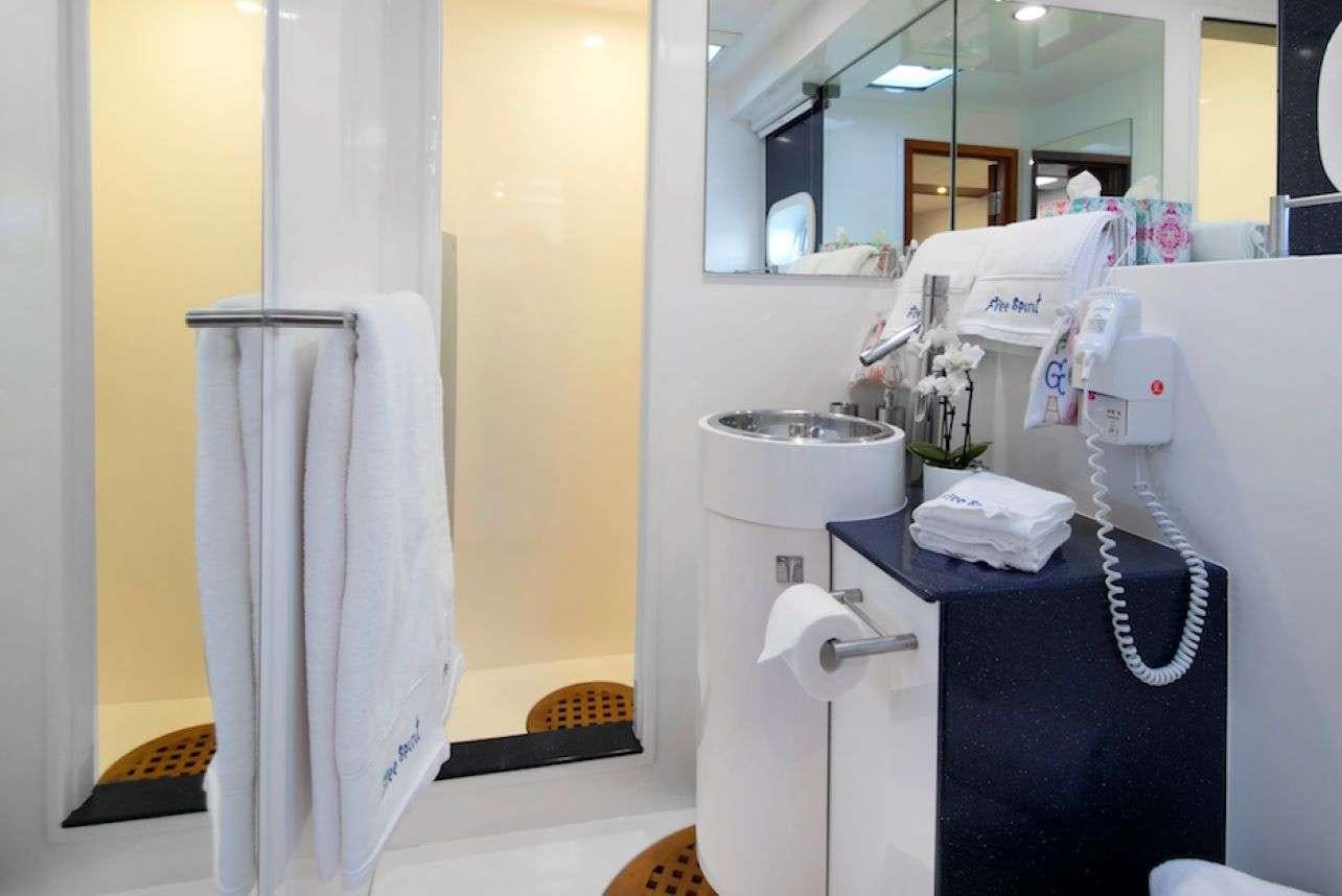 a bathroom with a towel and a sink aboard Free Spirit Yacht for Charter