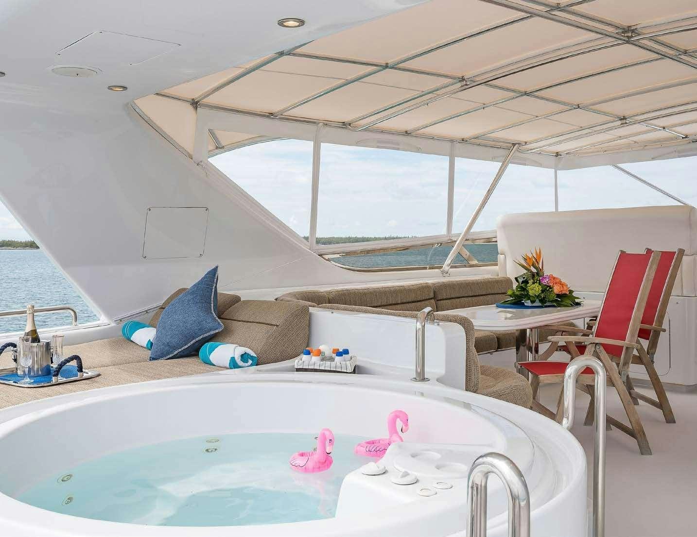 a room with a table and chairs aboard QUINTESSA Yacht for Charter