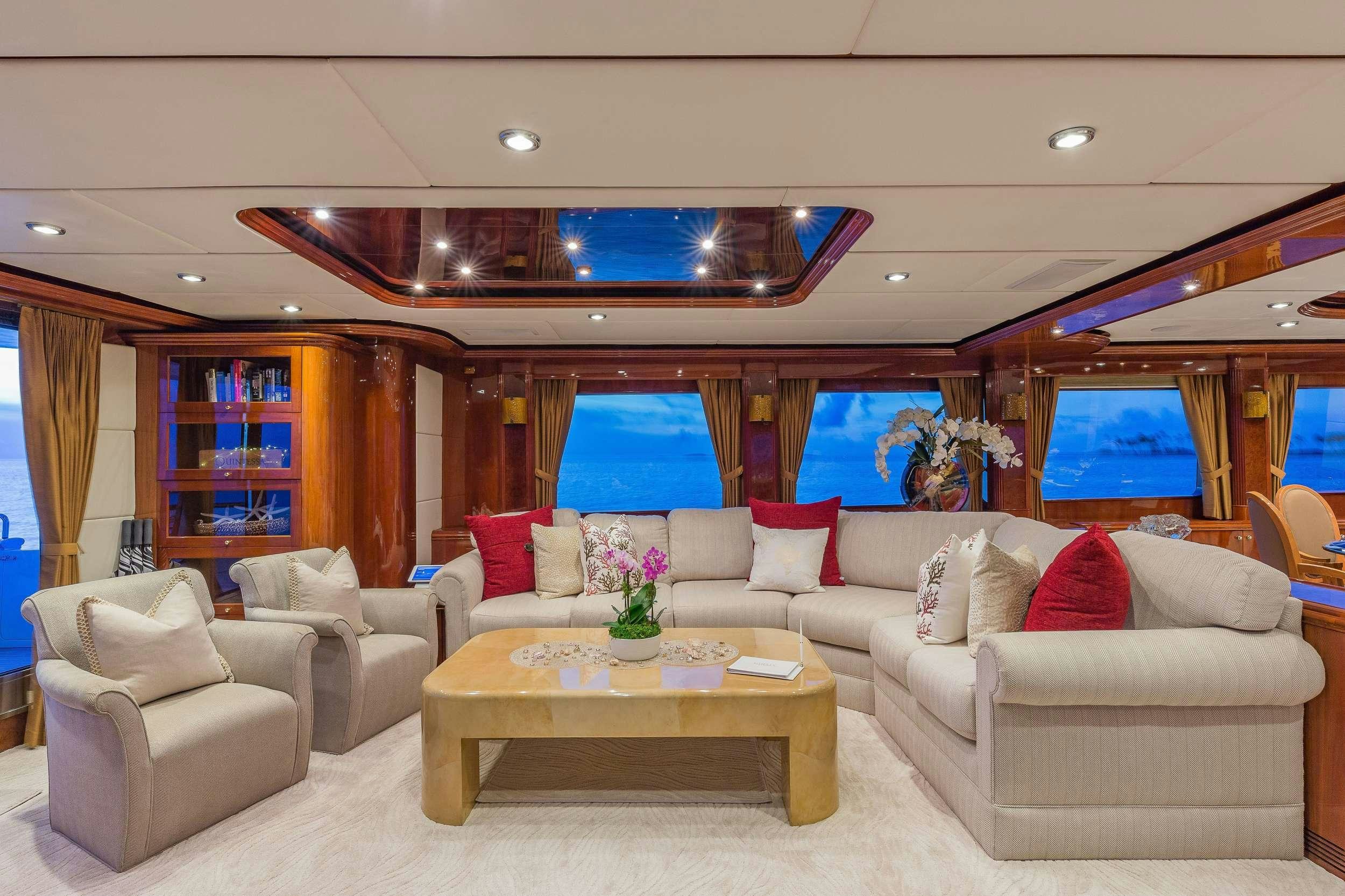 a living room with a large window aboard QUINTESSA Yacht for Charter