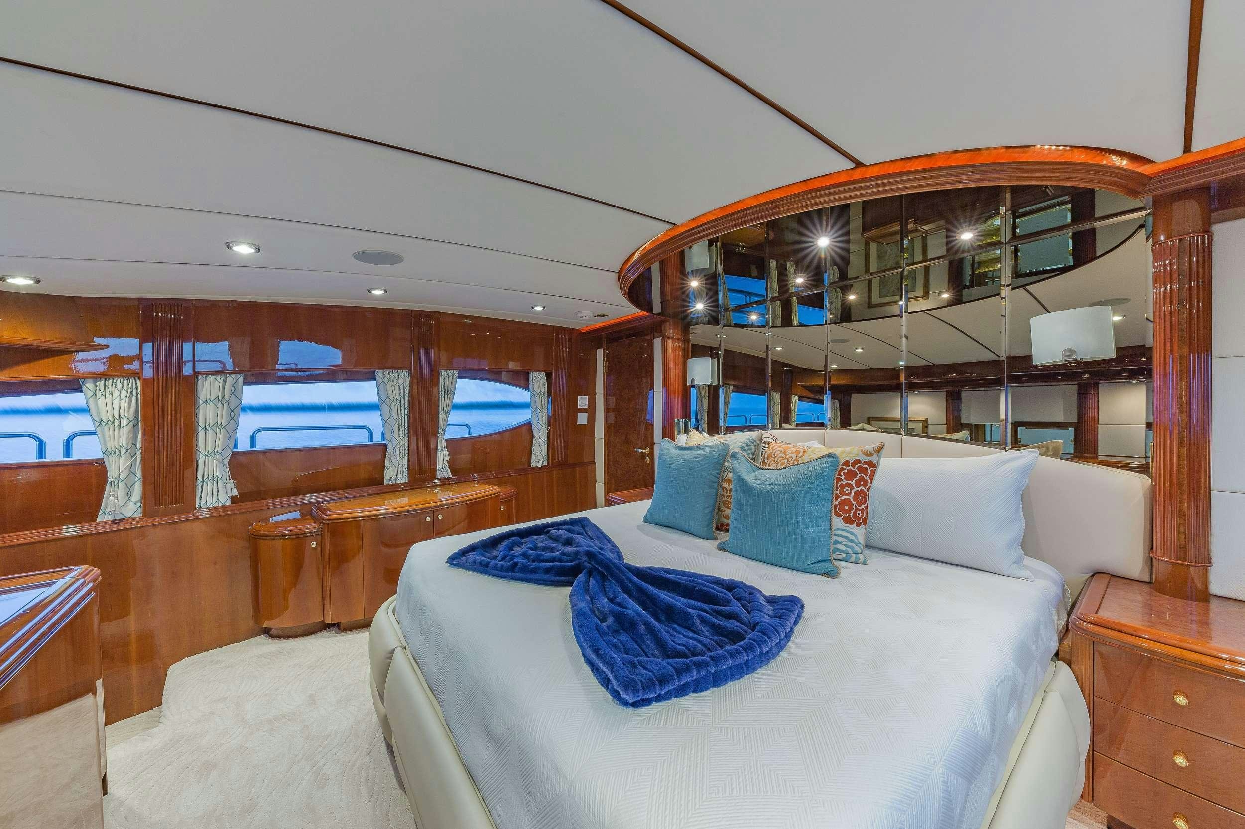a bed in a room aboard QUINTESSA Yacht for Charter